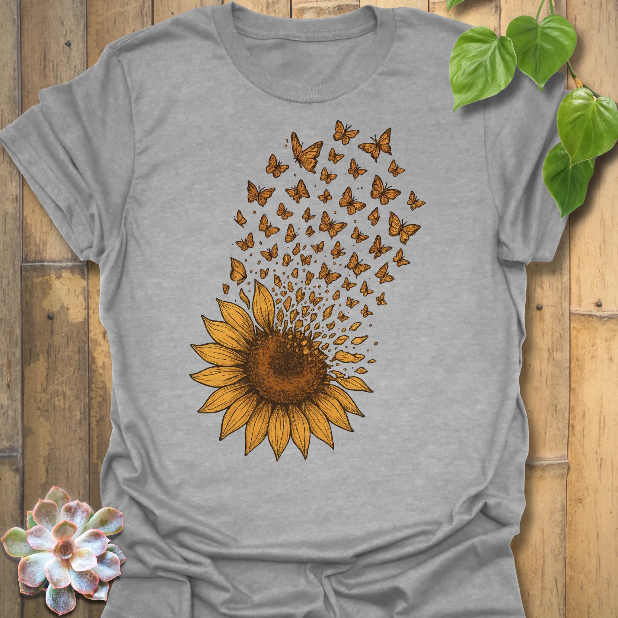Relaxed and versatile, this Sport Grey Sunflower Butterfly tee captures the beauty of transformation in a timeless everyday style.