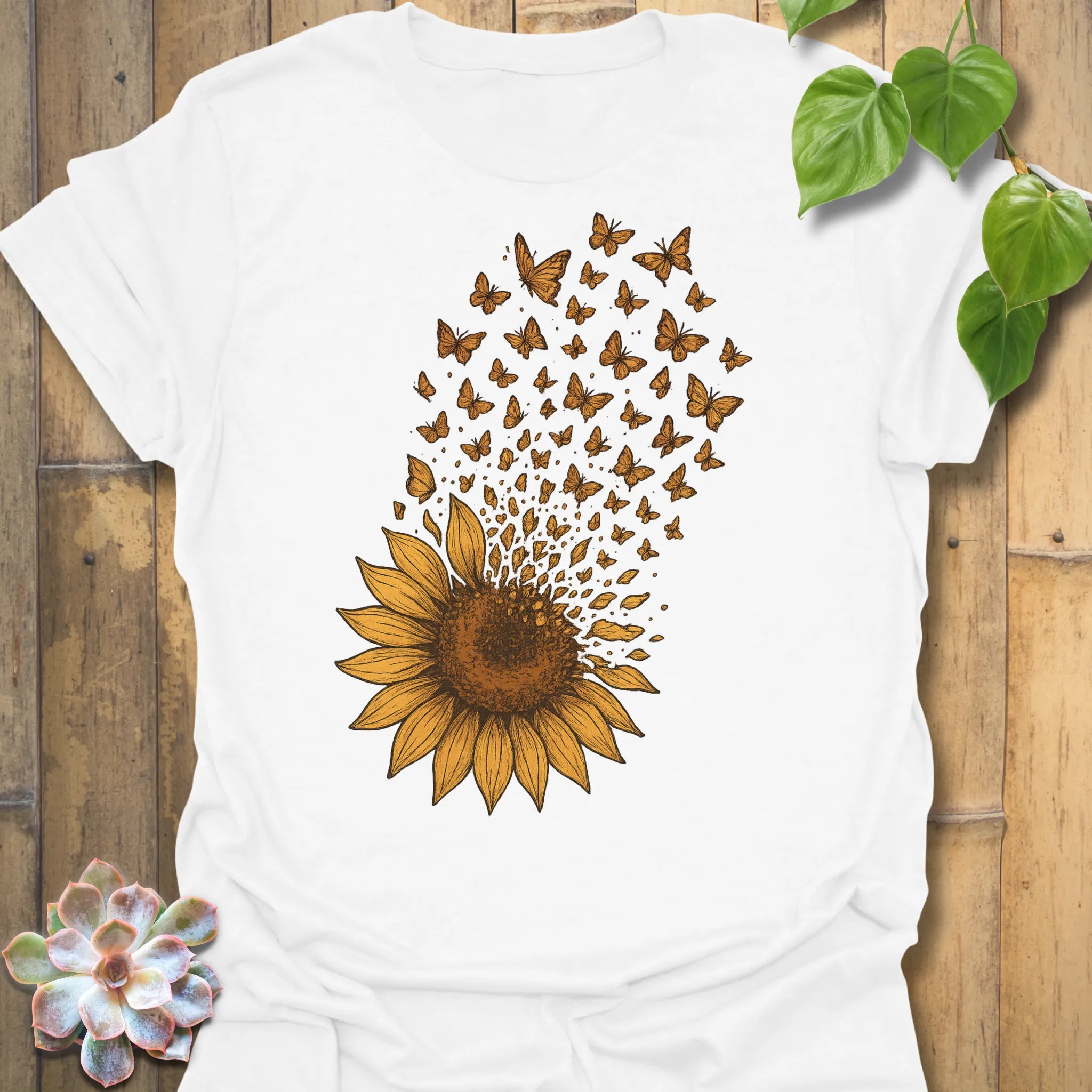 Bright and fresh, our White Sunflower Butterfly tee showcases a golden sunflower dissolving into butterflies — simple, joyful, and full of life.
