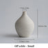white ceramic table vase