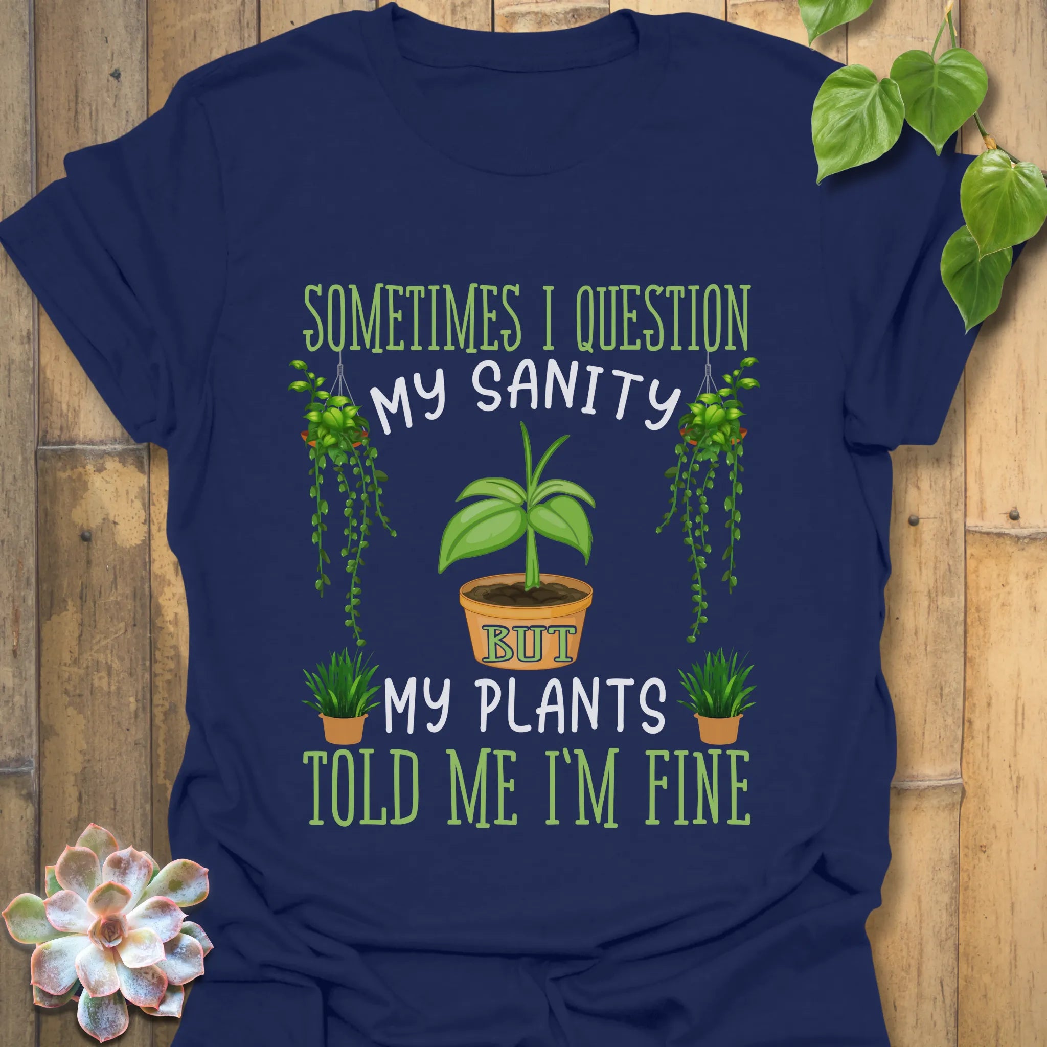 Navy blue t-shirt displaying the words “Sometimes I question my sanity but my plants told me I&