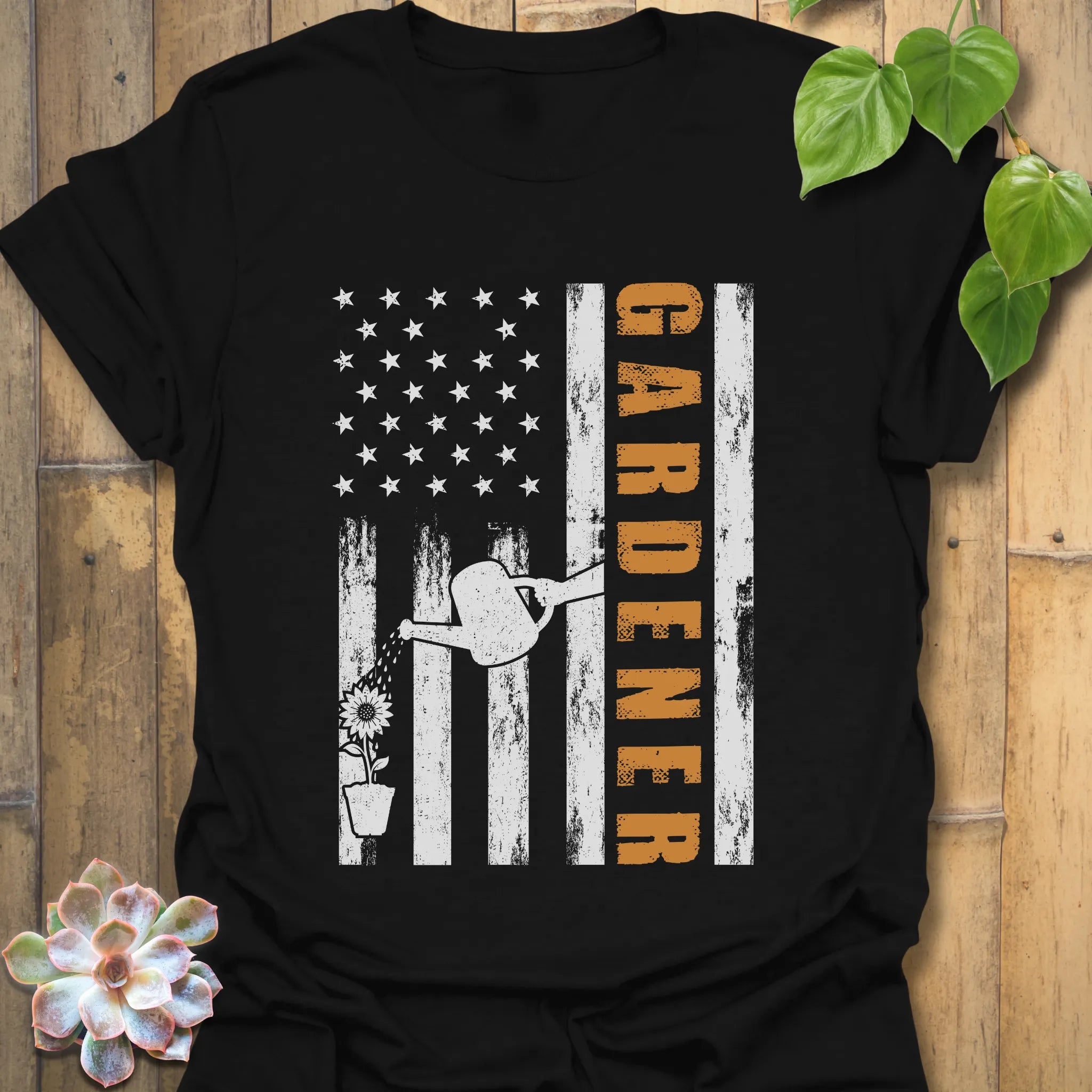 Black American flag gardening t-shirt featuring the design Gardener with a vertical word, plant, and watering sprinkler print, a thoughtful gift for gardeners