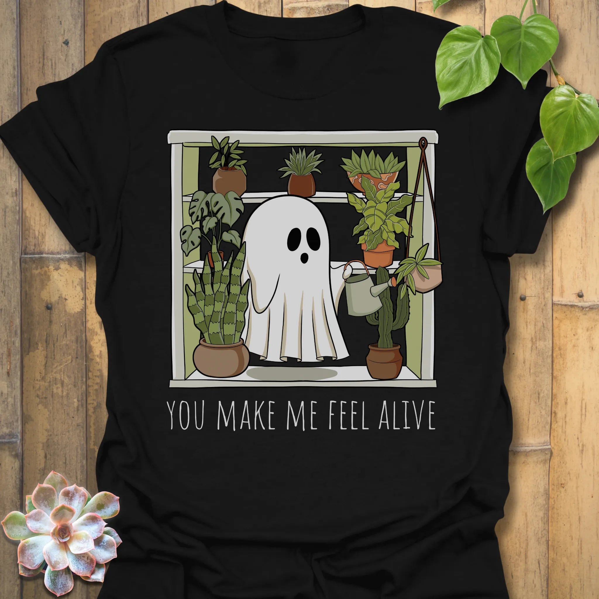Black t-shirt featuring the design Feel Alive printed halloween motivational graphic tee.