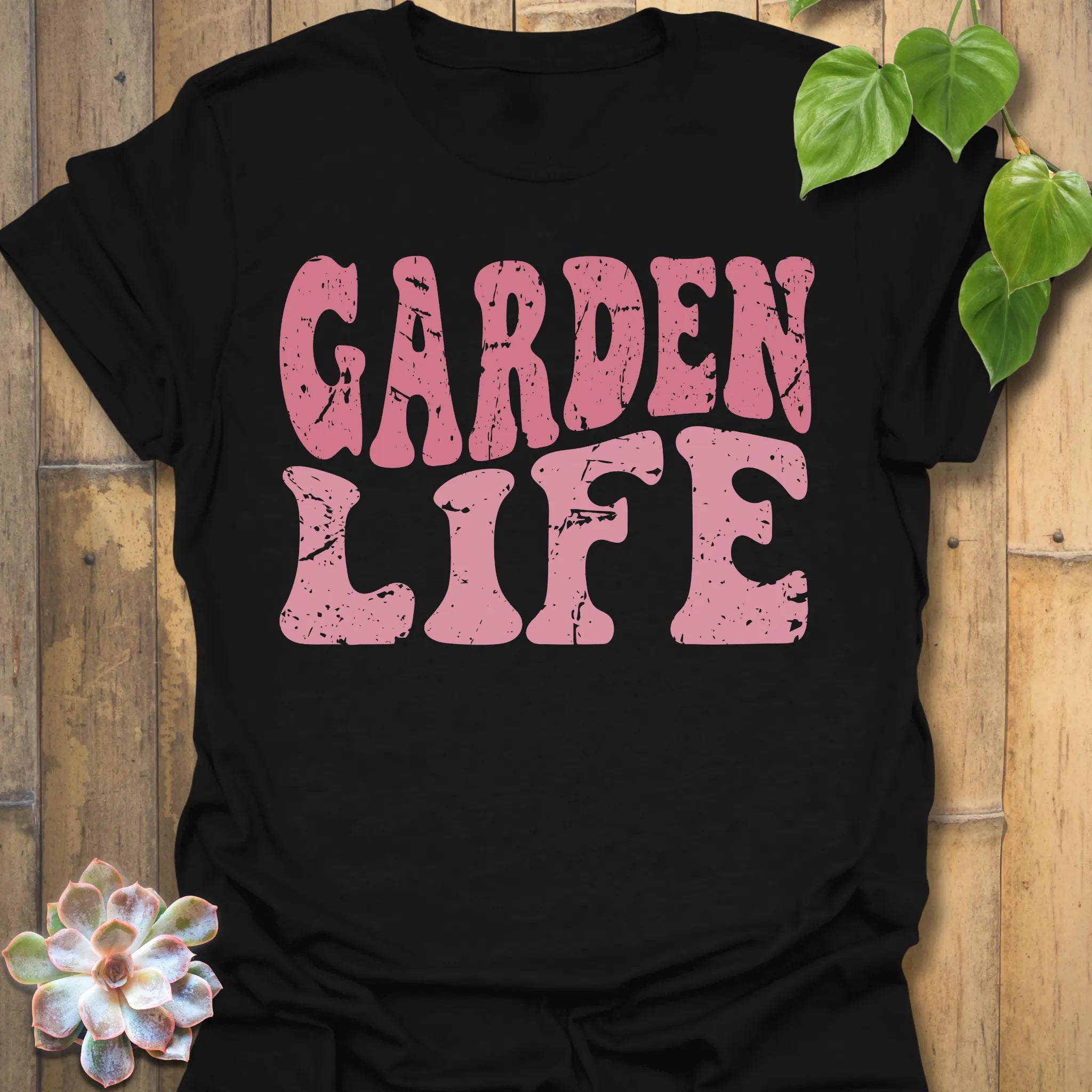 Black t-shirt featuring the design Garden Life printed in bold letters, garden lover shirt.