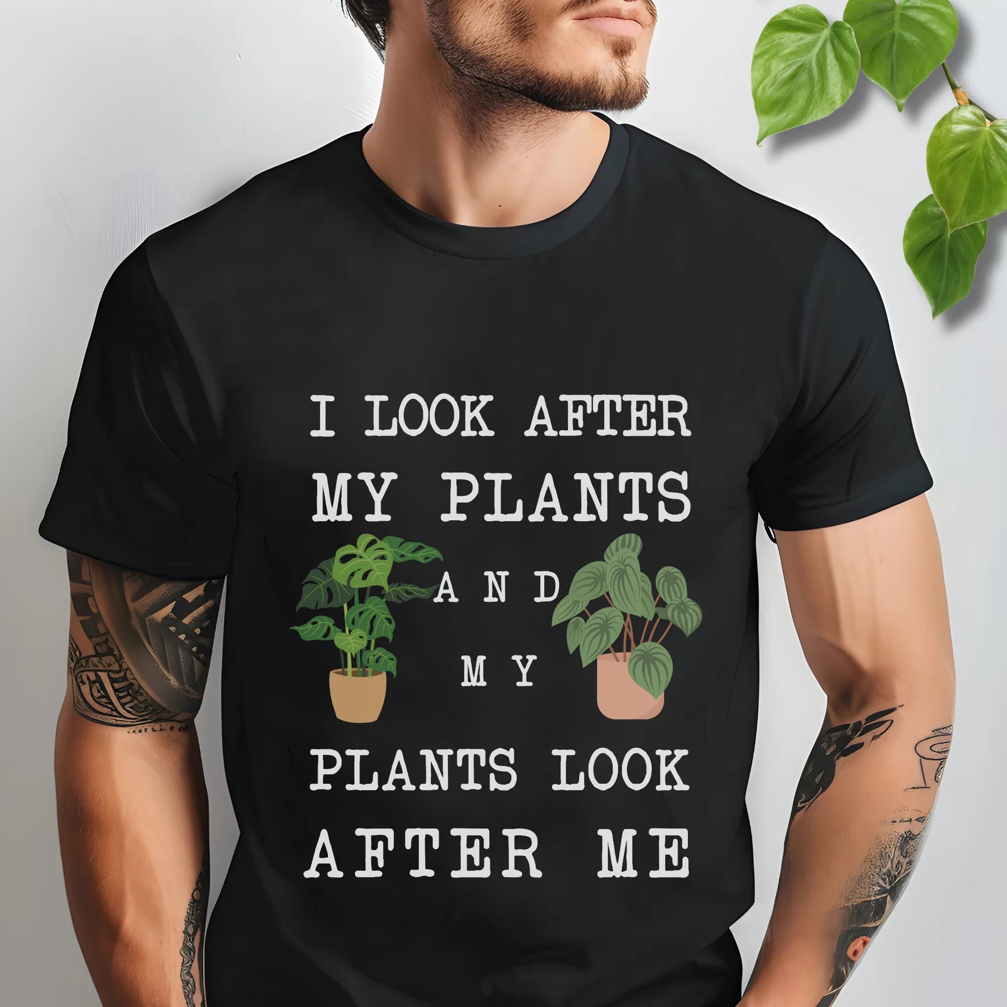 Black t-shirt featuring the design “I look after My Plants and my plants look after me” plant mom t-shirt.