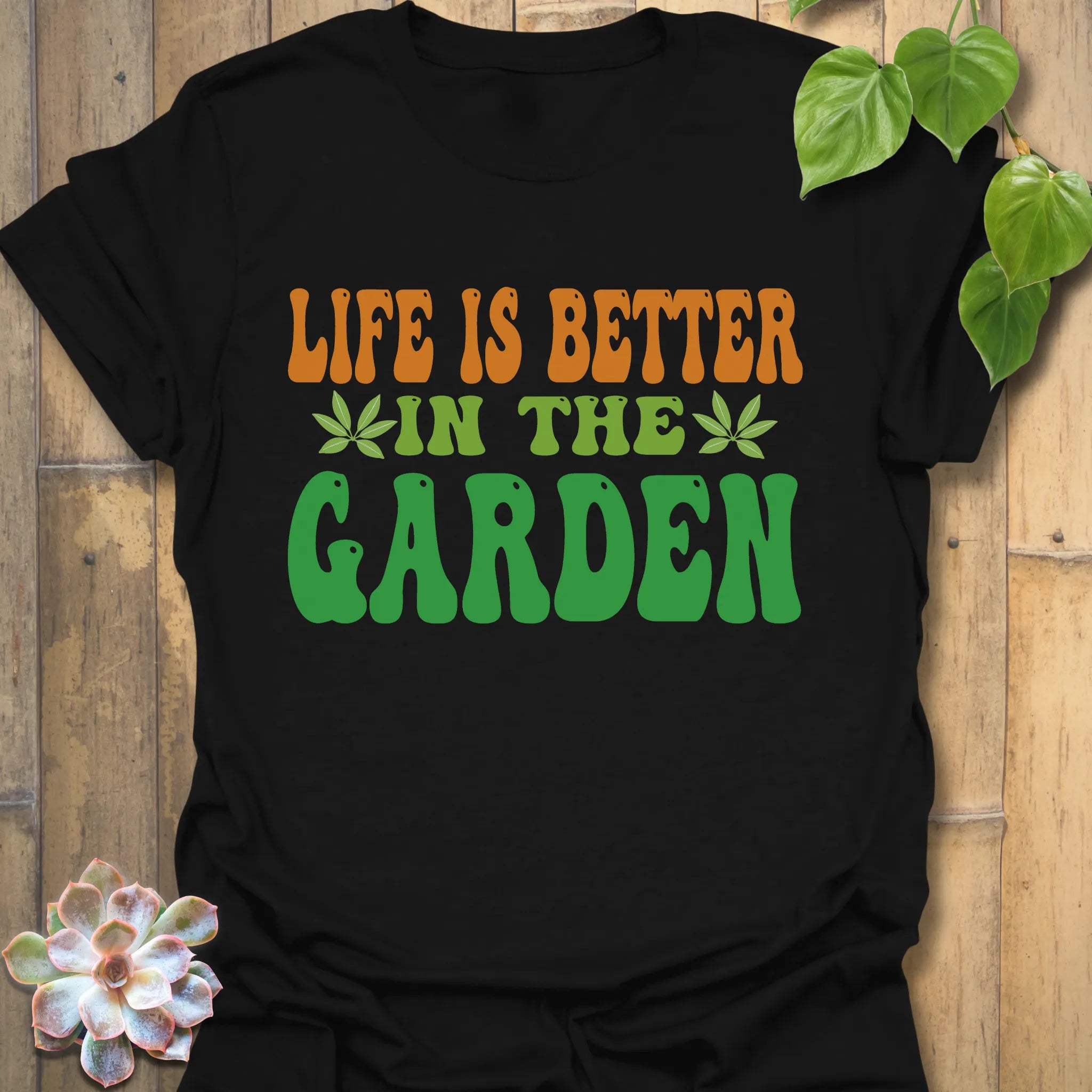 Black t-shirt featuring the design Life Is Better printed in bold letters, positive vibes t-shirt.