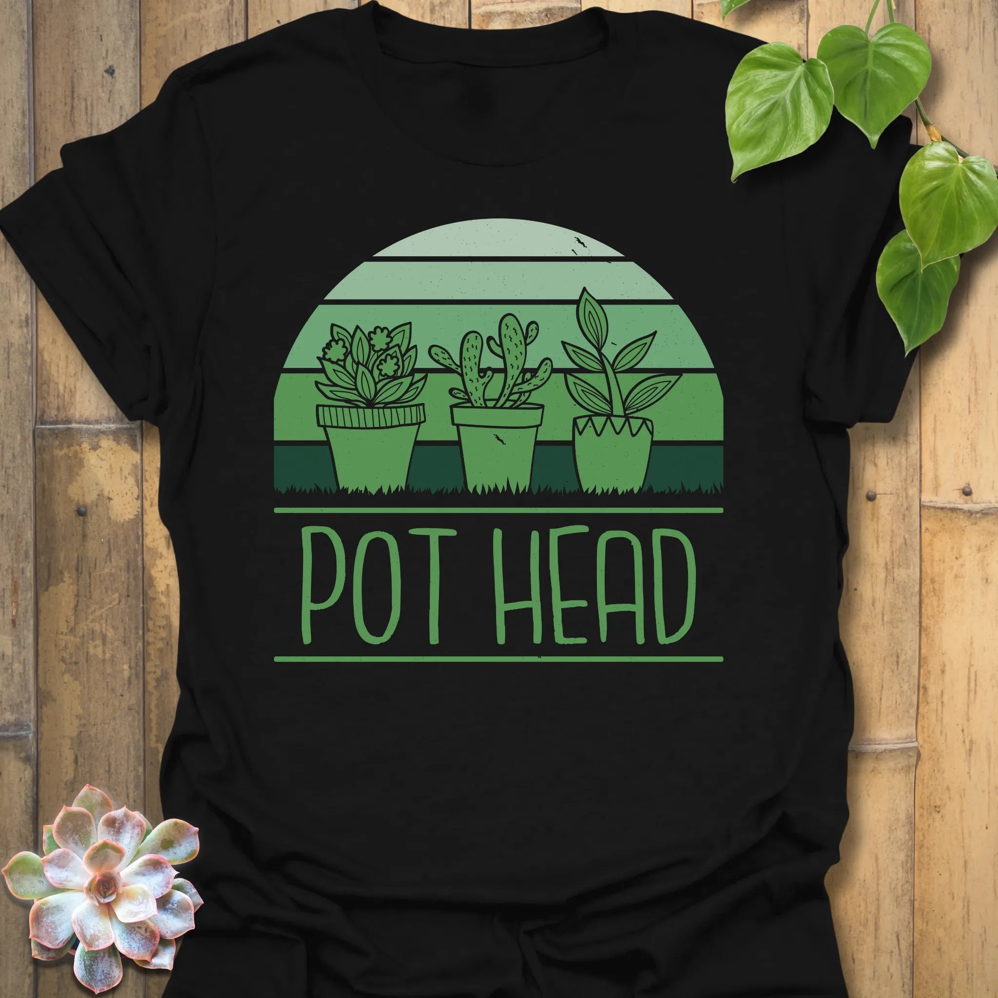Black t-shirt featuring the design Pot Head printed in bold green letters, garden lover shirt.