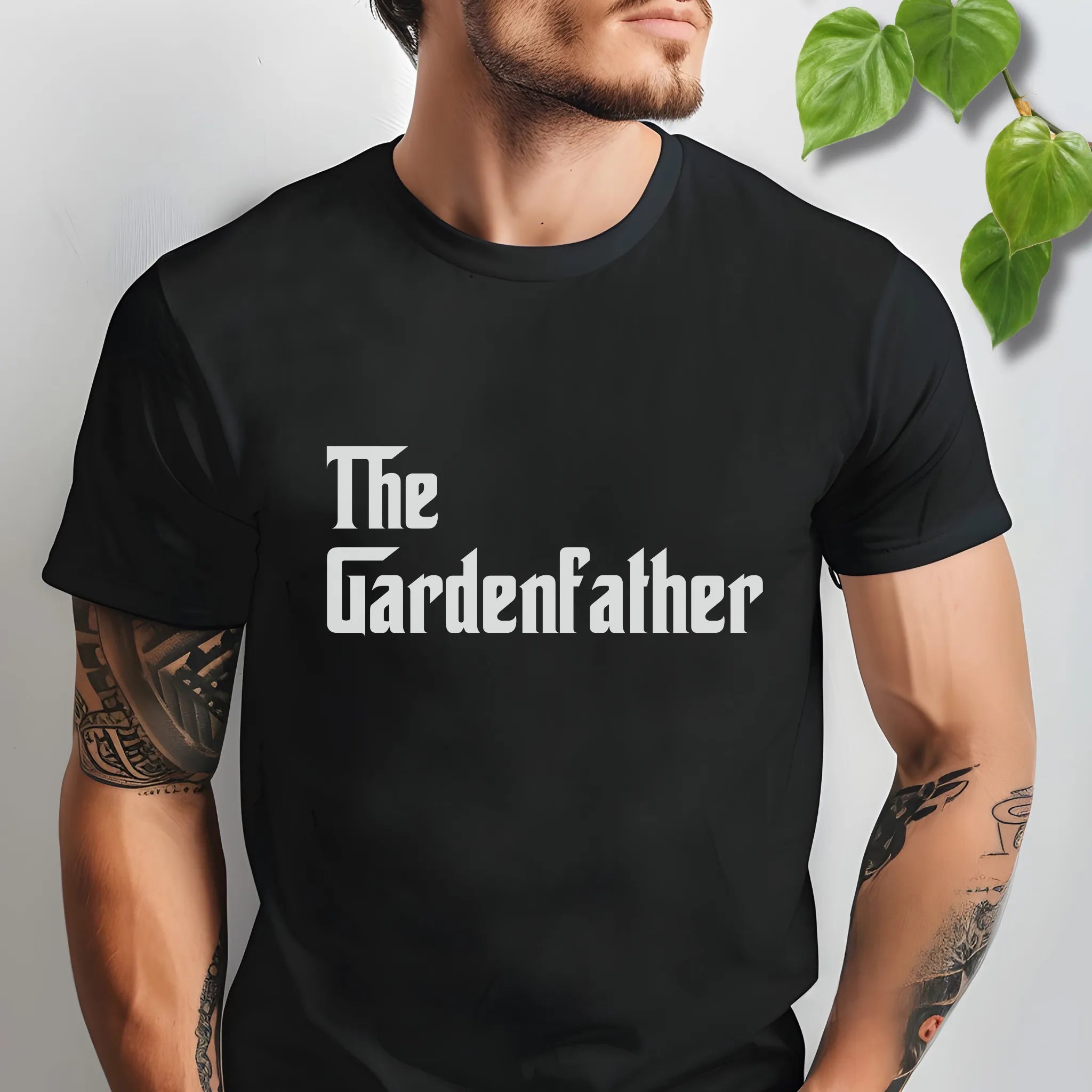Black t-shirt featuring the design The Gardenfather printed in bold white letters, garden lover t-shirt.
