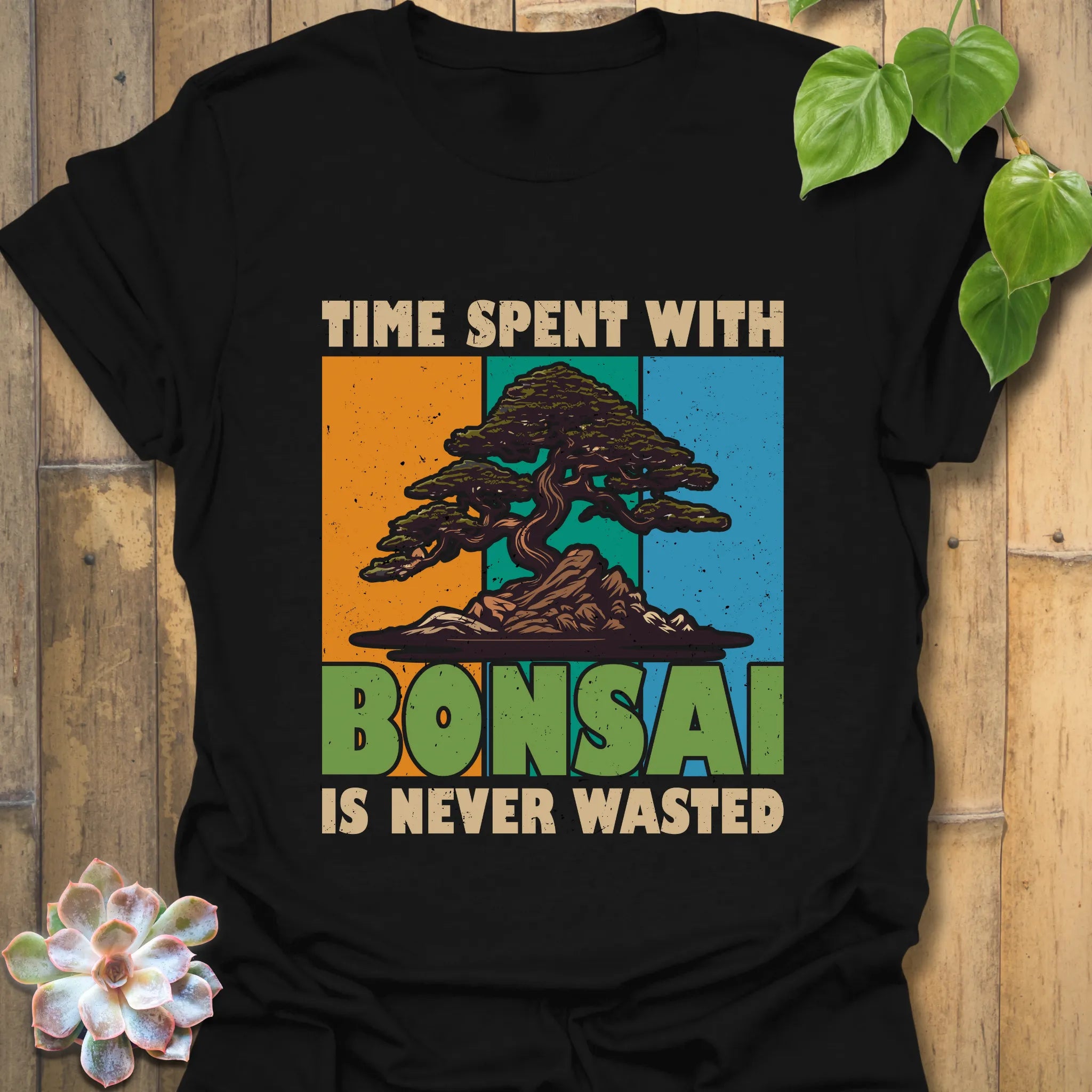 Black t-shirt featuring the design “Time spent with bonsai is never wasted” with a bonsai plant print, versatile and trendy for bonsai lovers and plant enthusiasts.