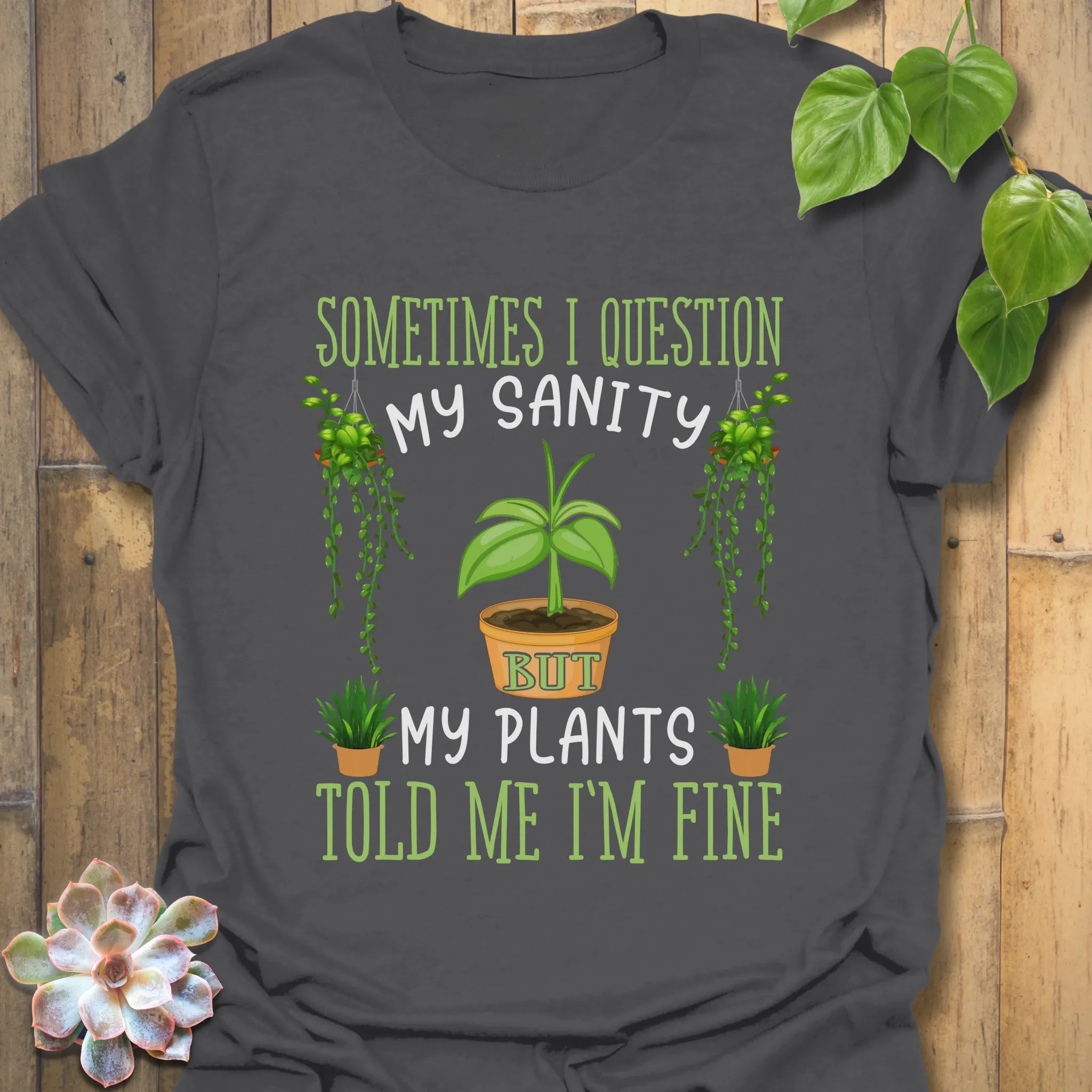 Charcoal grey t-shirt featuring the design “Sometimes I question my sanity but my plants told me I&