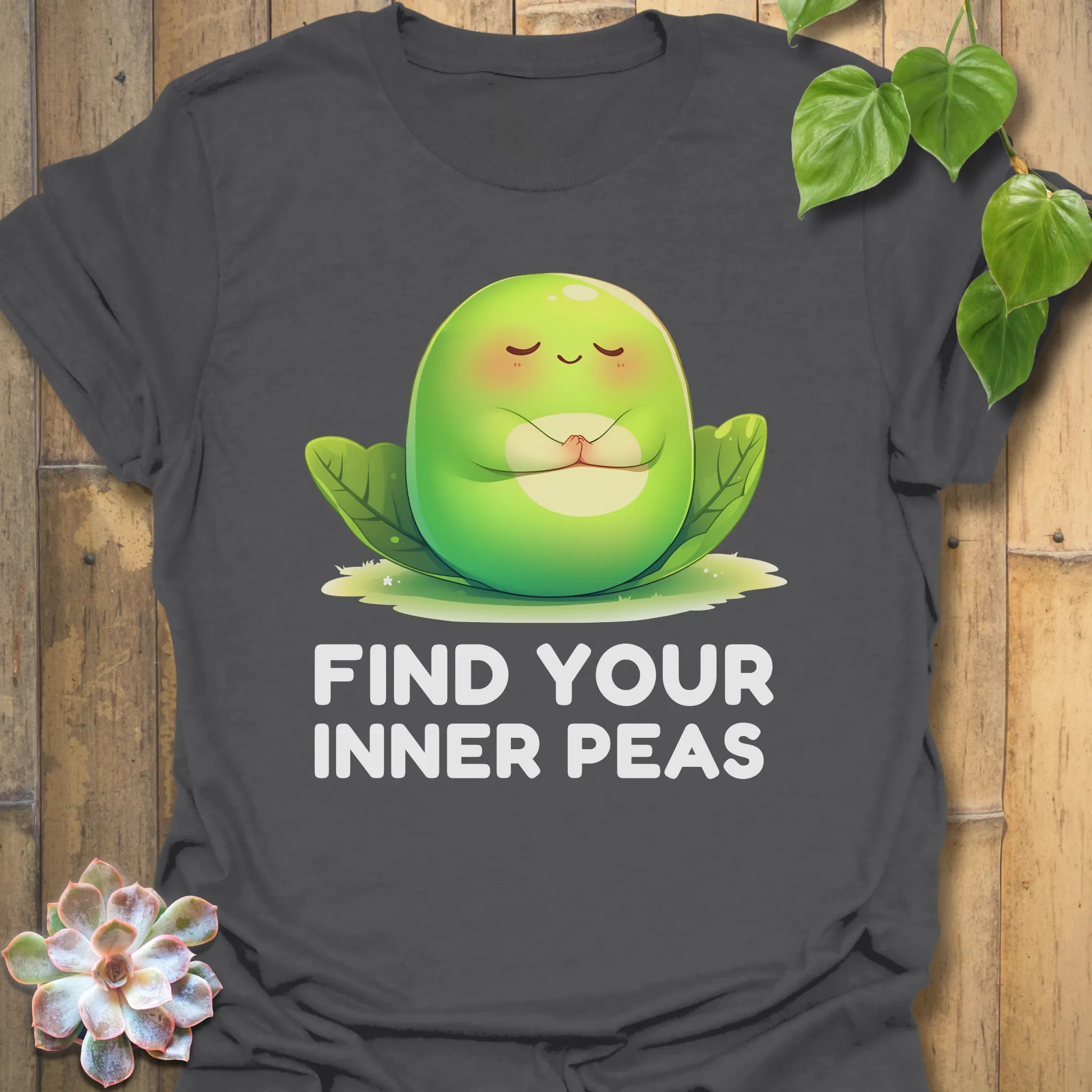 Charcoal t-shirt featuring the design Find Your Inner Peas printed in bold green letters with playful pea graphics