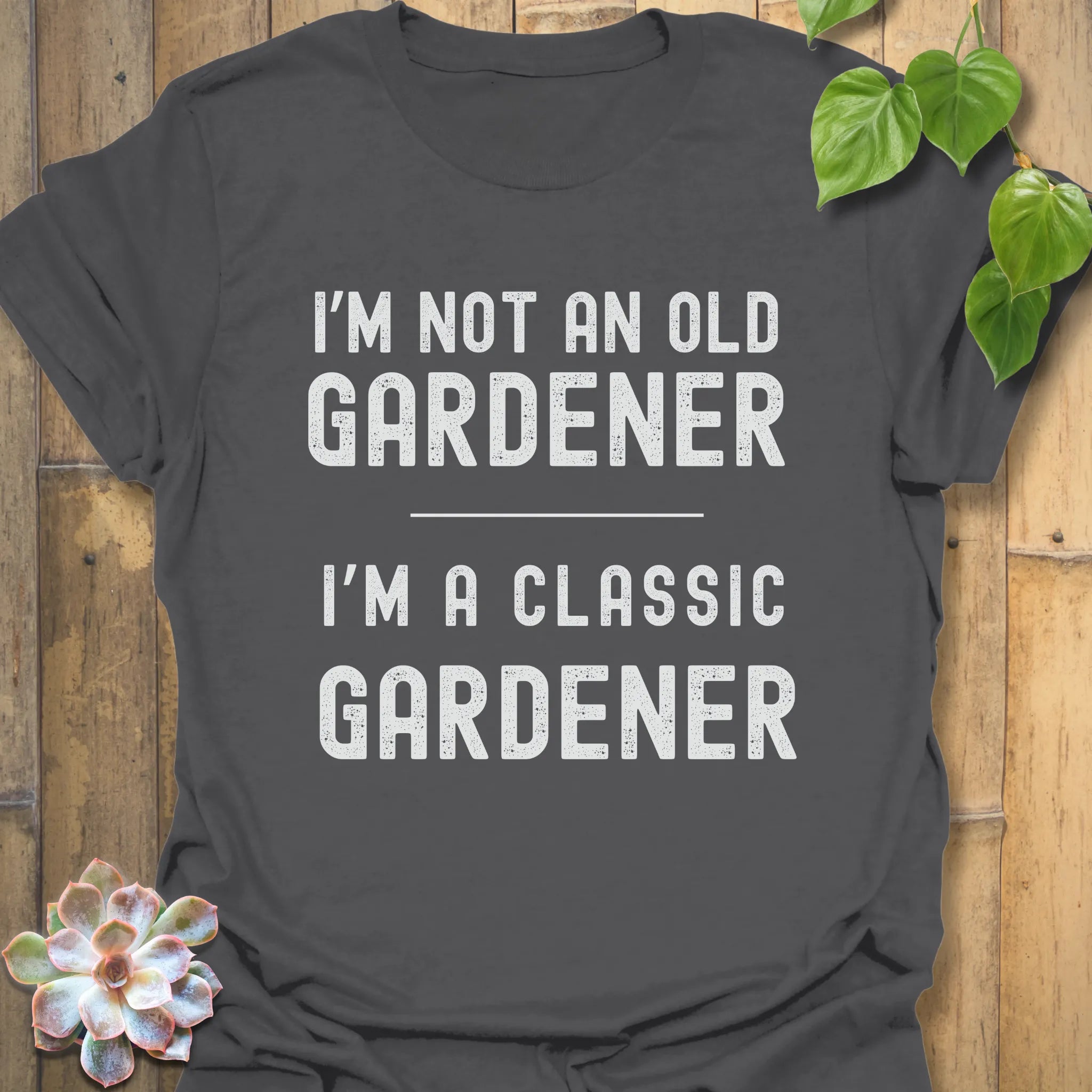 Charcoal t-shirt featuring the design “I’m not an older gardener, I’m a classic gardener” classic gardener t-shirt.