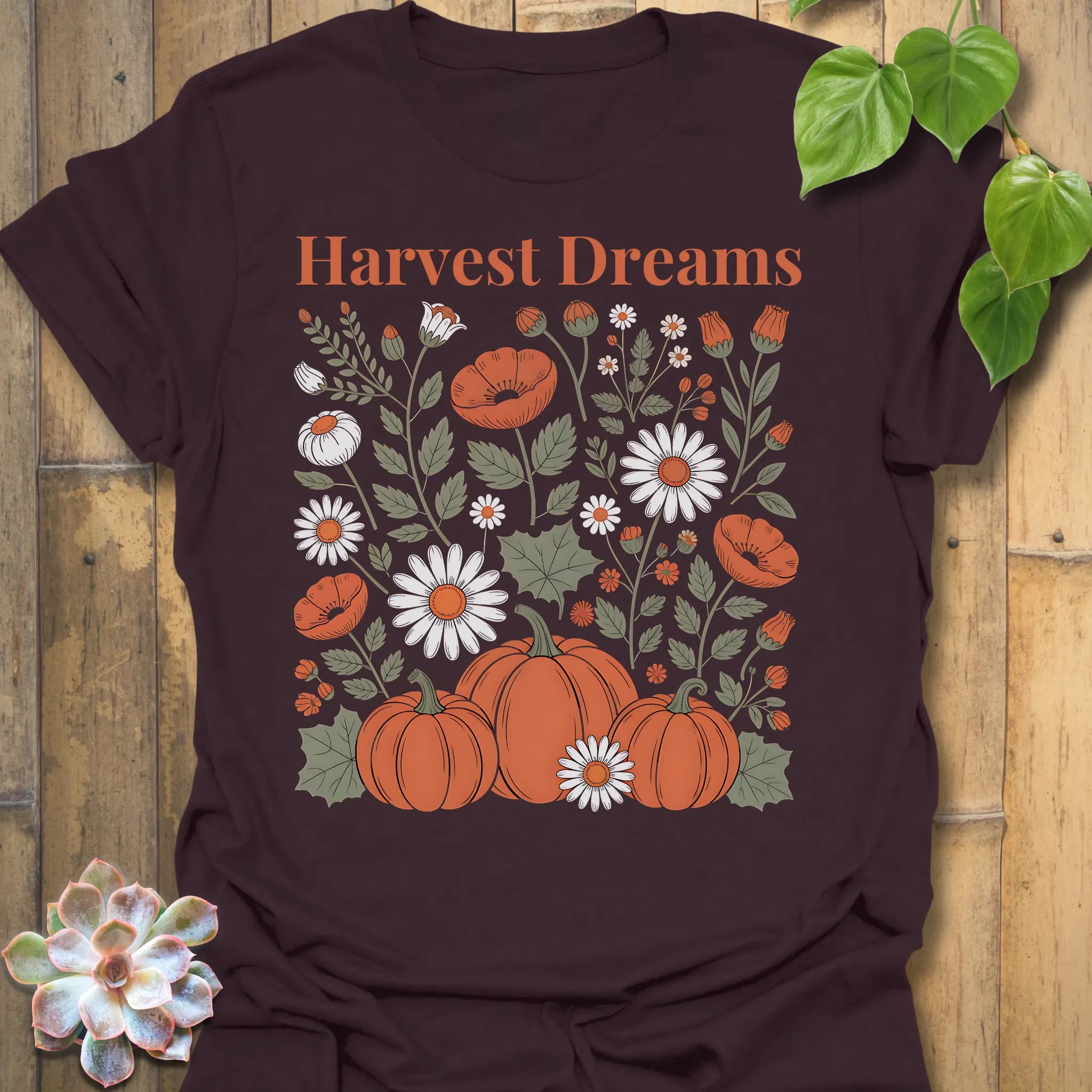 Dark Chocolate t-shirt featuring the design Harvest Dreams printed in bold orange letters, cosy harvest tee.