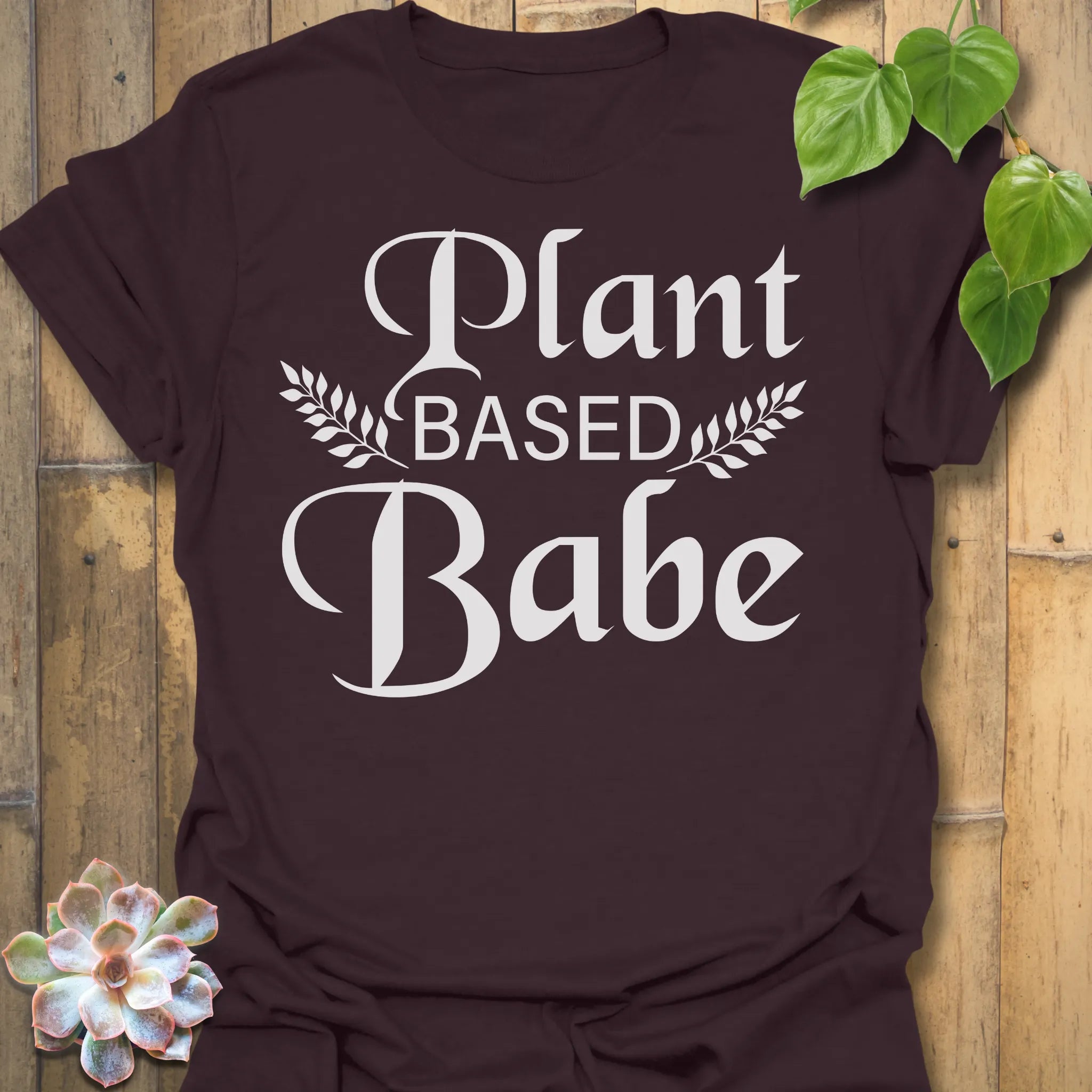 Dark Chocolate t-shirt featuring the design Plant Based Babe printed in bold white letters, plant lover vegan shirt.
