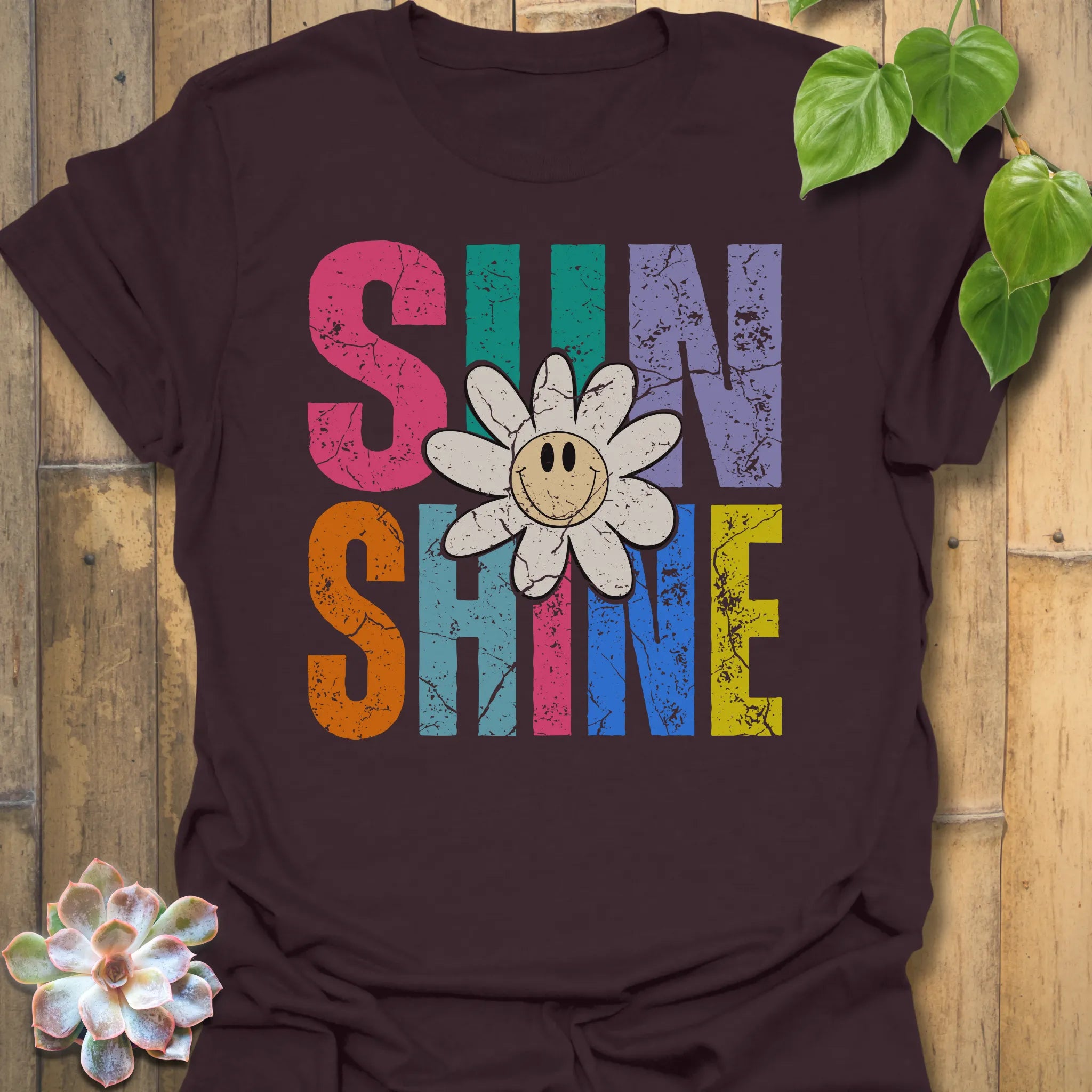 Dark Chocolate t-shirt featuring the design Sunshine printed in bold colorful letters, funny sunflower casual summer shirt.