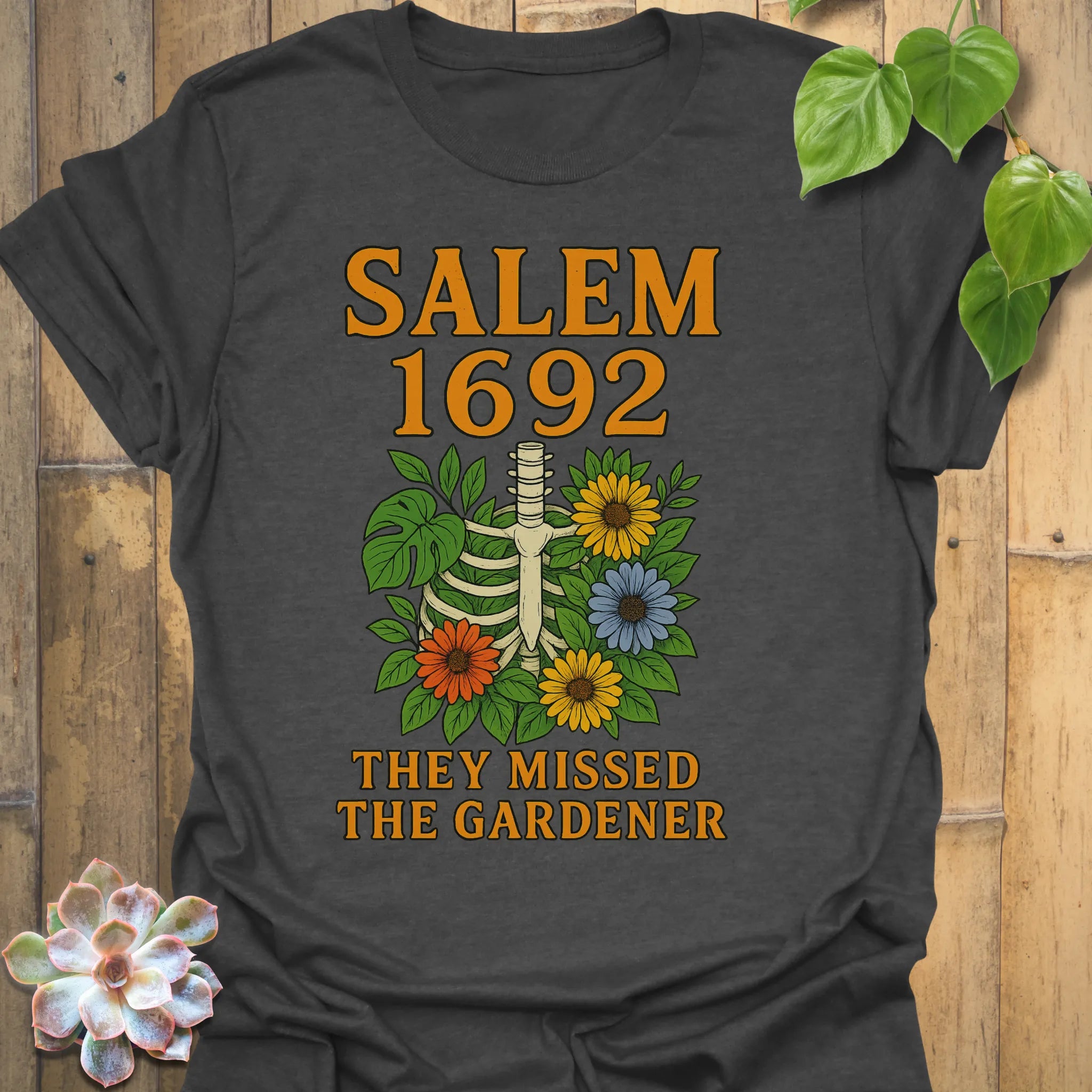 Dark Heather t-shirt featuring the design Salem 1692 printed in bold letters, vintage halloween graphic tee.