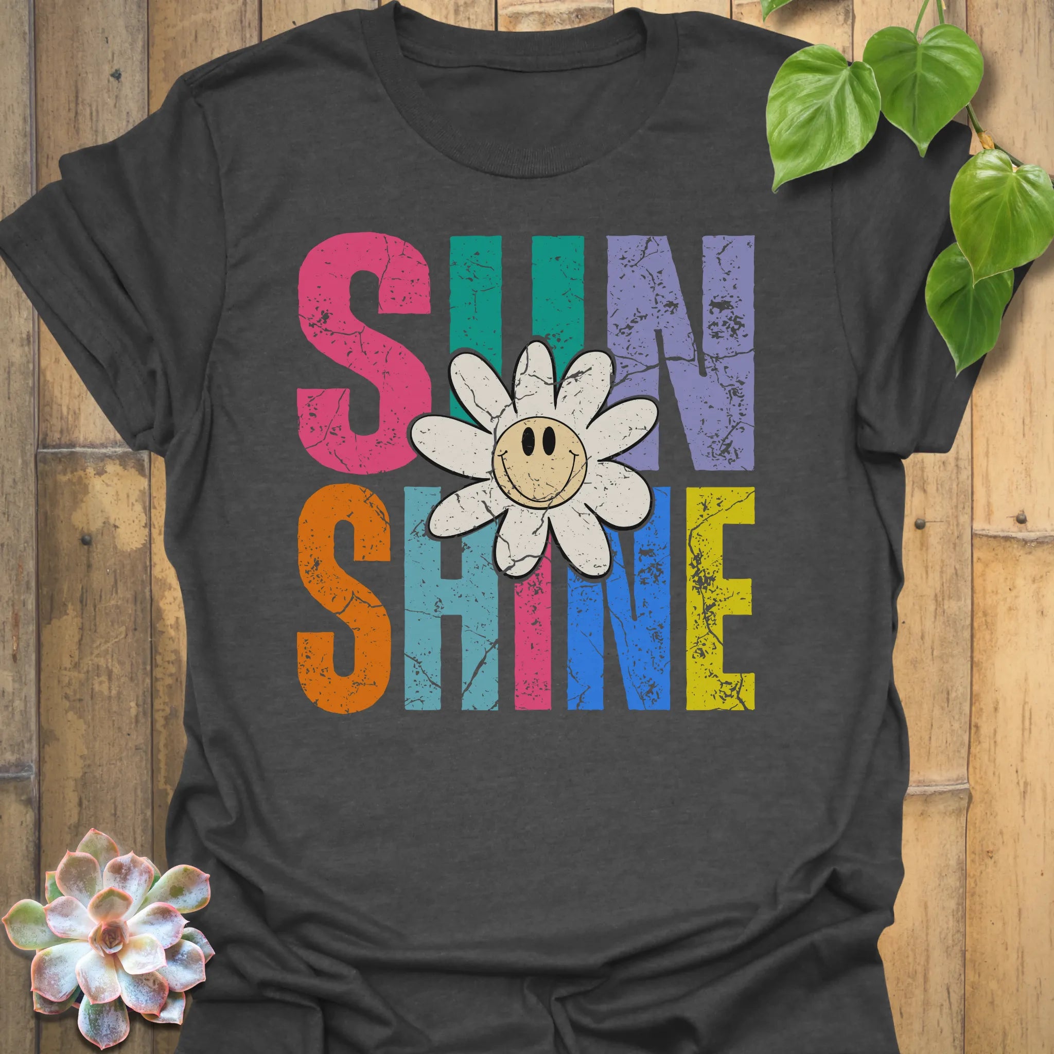 Dark Heather t-shirt featuring the design Sunshine printed in bold colorful letters, funny sunflower casual summer shirt.