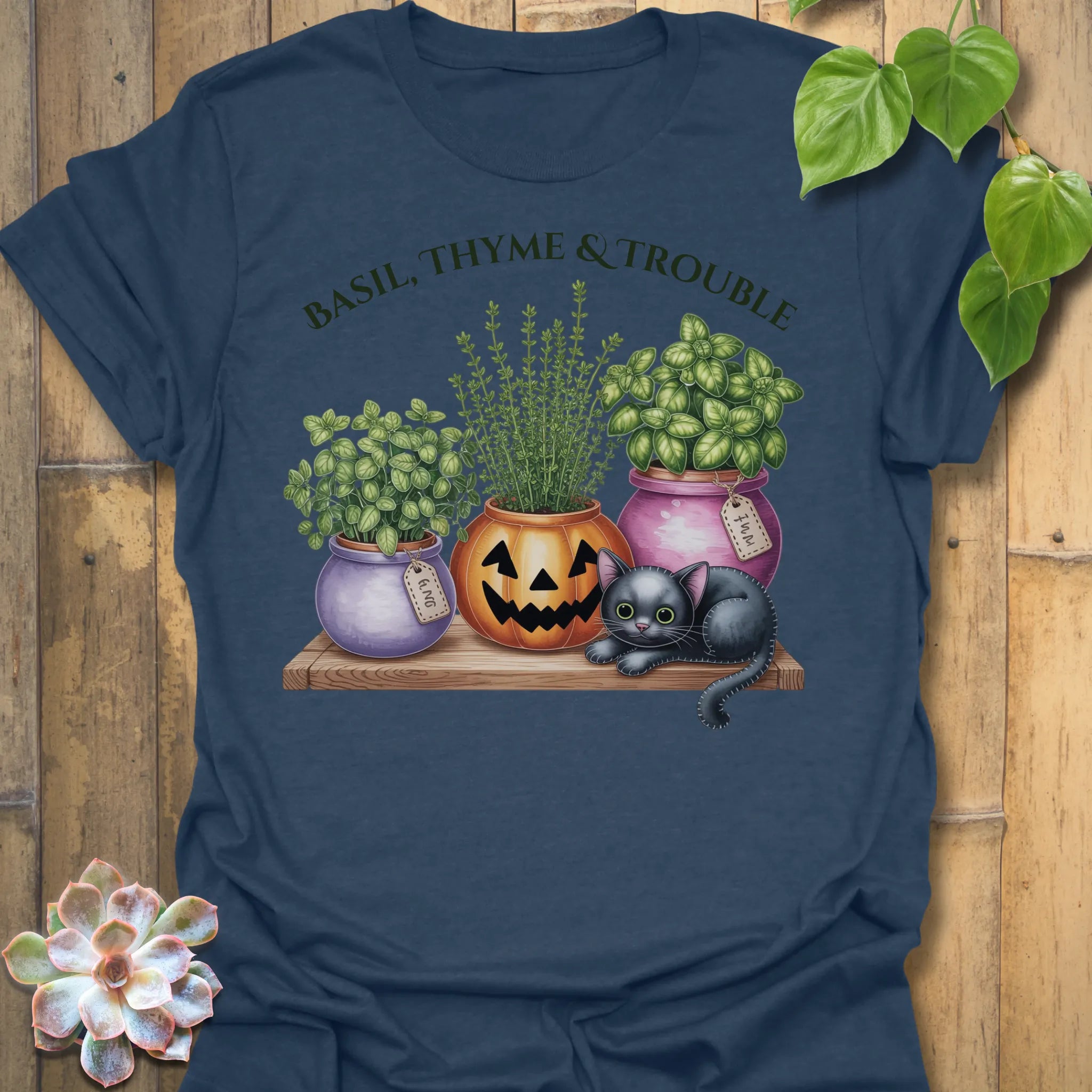 Heather Navy t-shirt featuring the design Basil, Thyme & Trouble printed in bold letters, plant and herb lover tee.