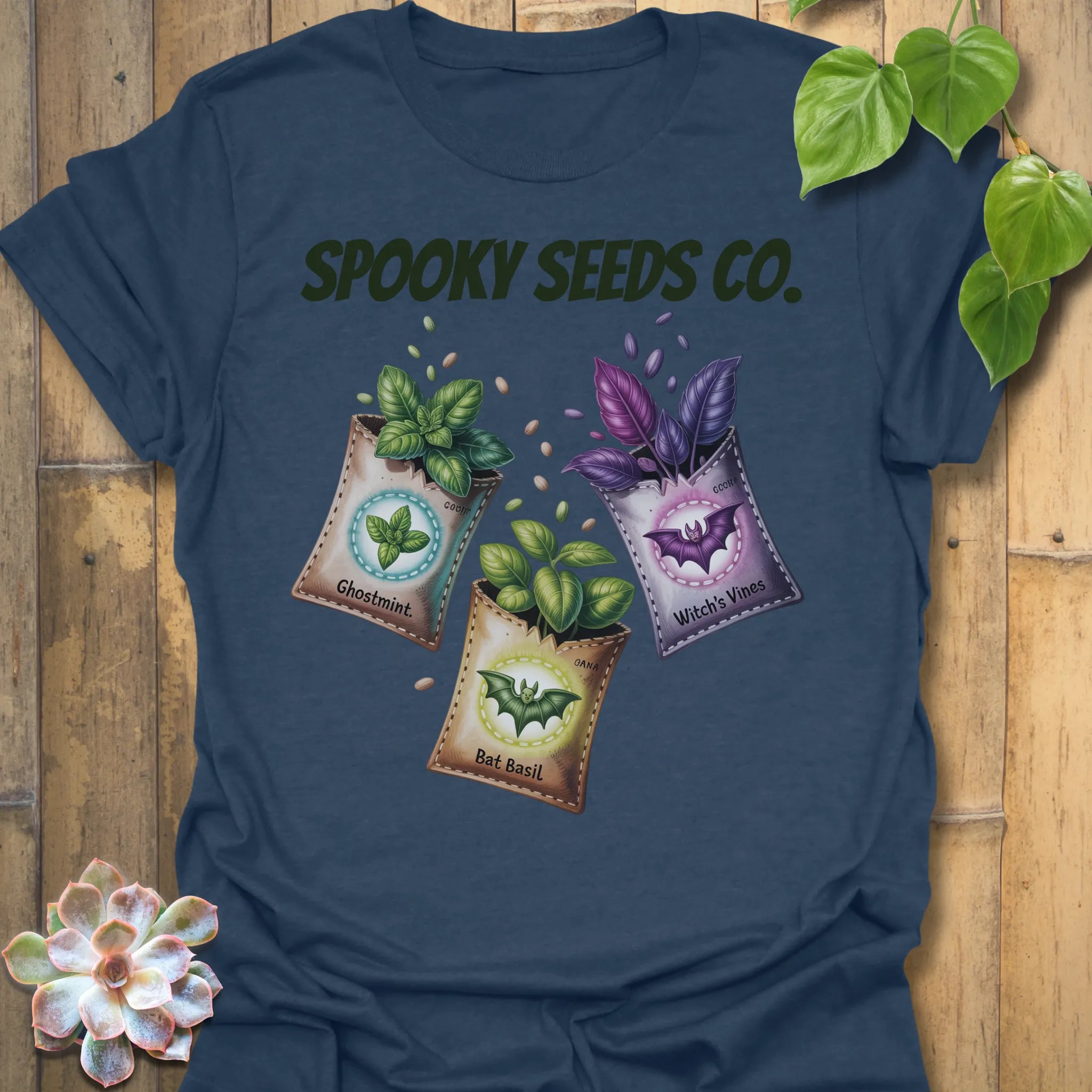 Heather Navy t-shirt featuring the design Spooky Seeds Co. printed in bold letters, spooky plant lover shirt.