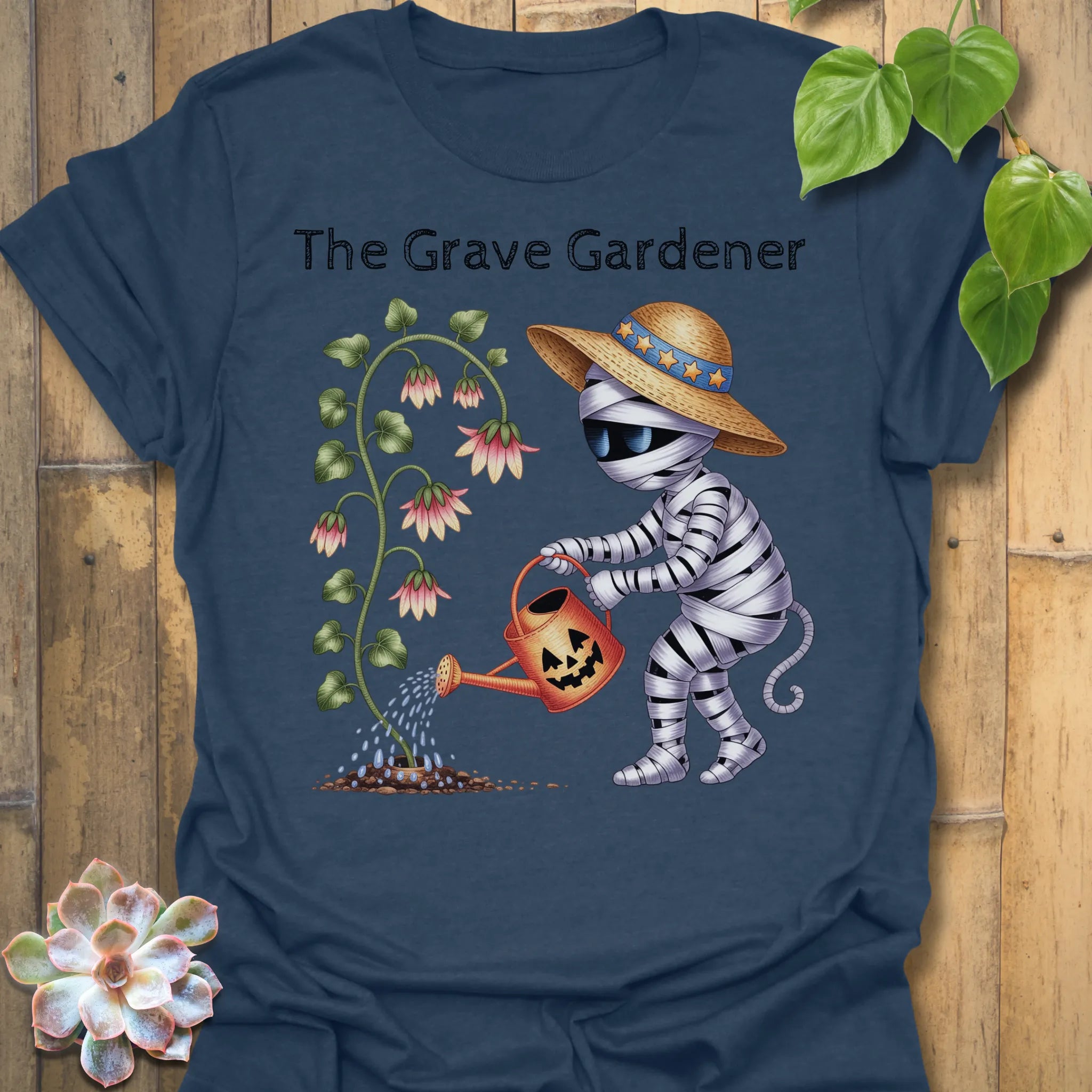 Heather Navy t-shirt featuring the design The Grave Gardener printed in halloween plant shirt.