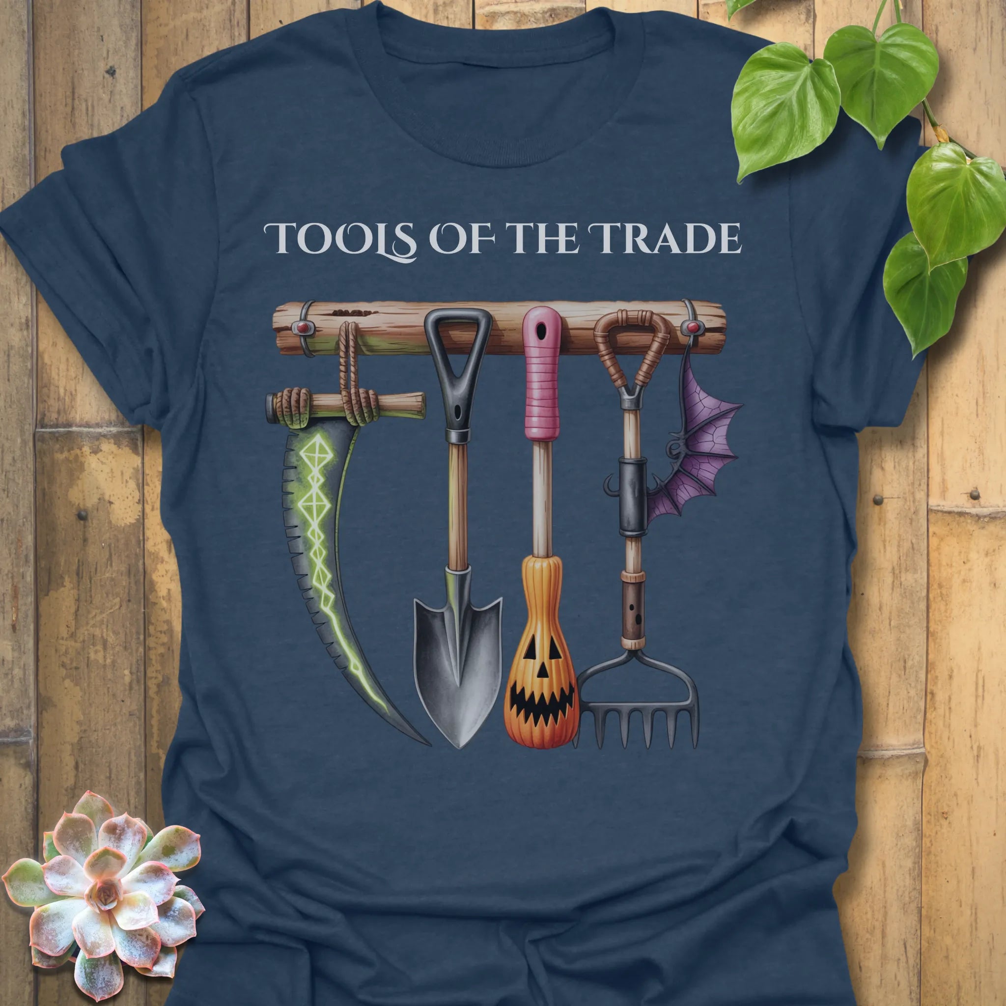 Heather Navy t-shirt featuring the design Tools Of The Trade printed in bold letters, garden tools shirt.