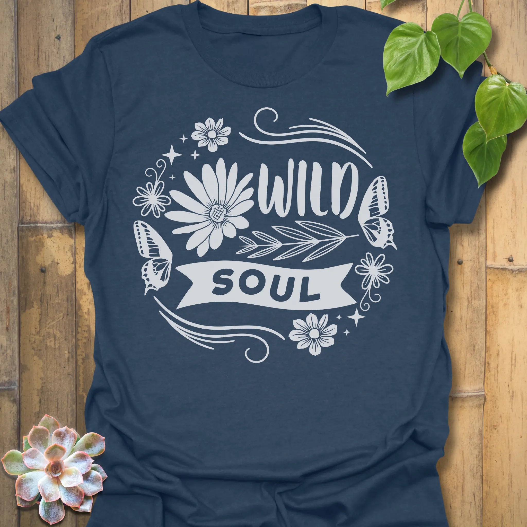 Heather Navy t-shirt featuring the design Wild Soul printed in bold black letters, floral graphic tee.