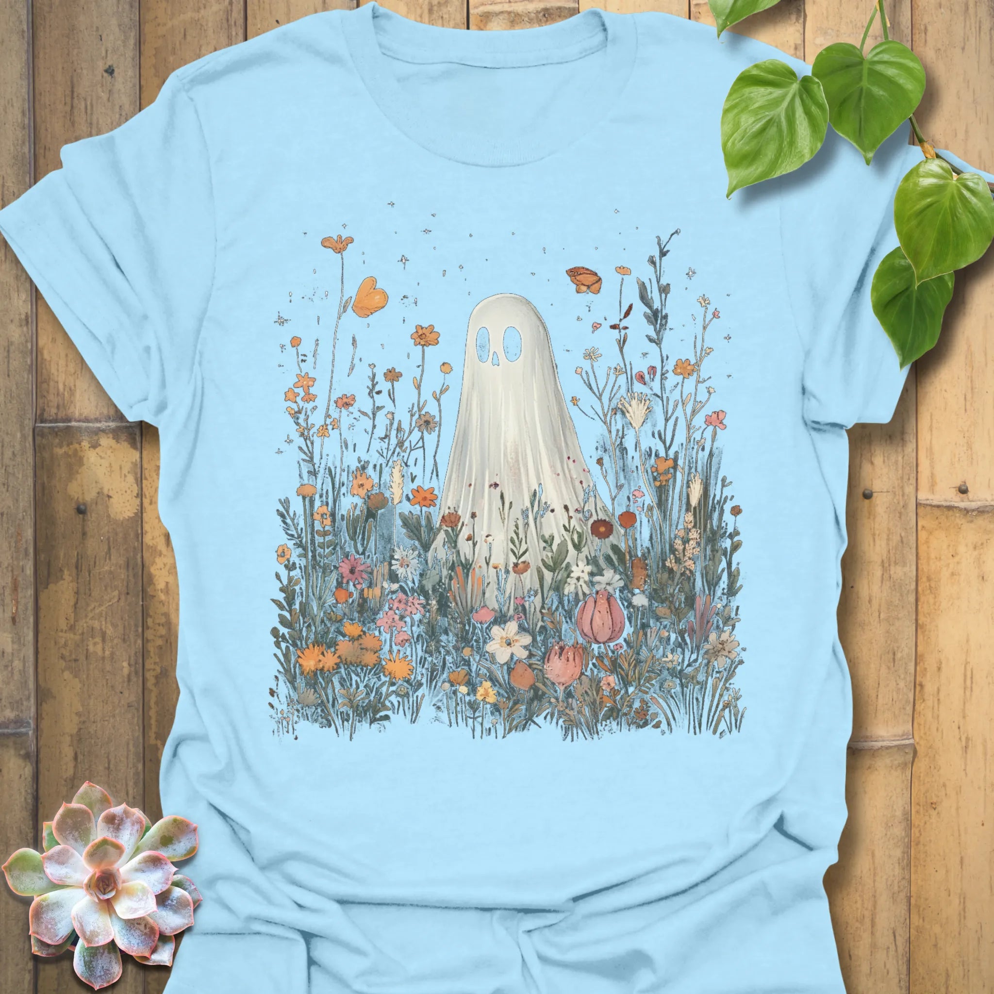Light Blue t-shirt featuring the design Among The Wildflowers printed in halloween floral graphic tee