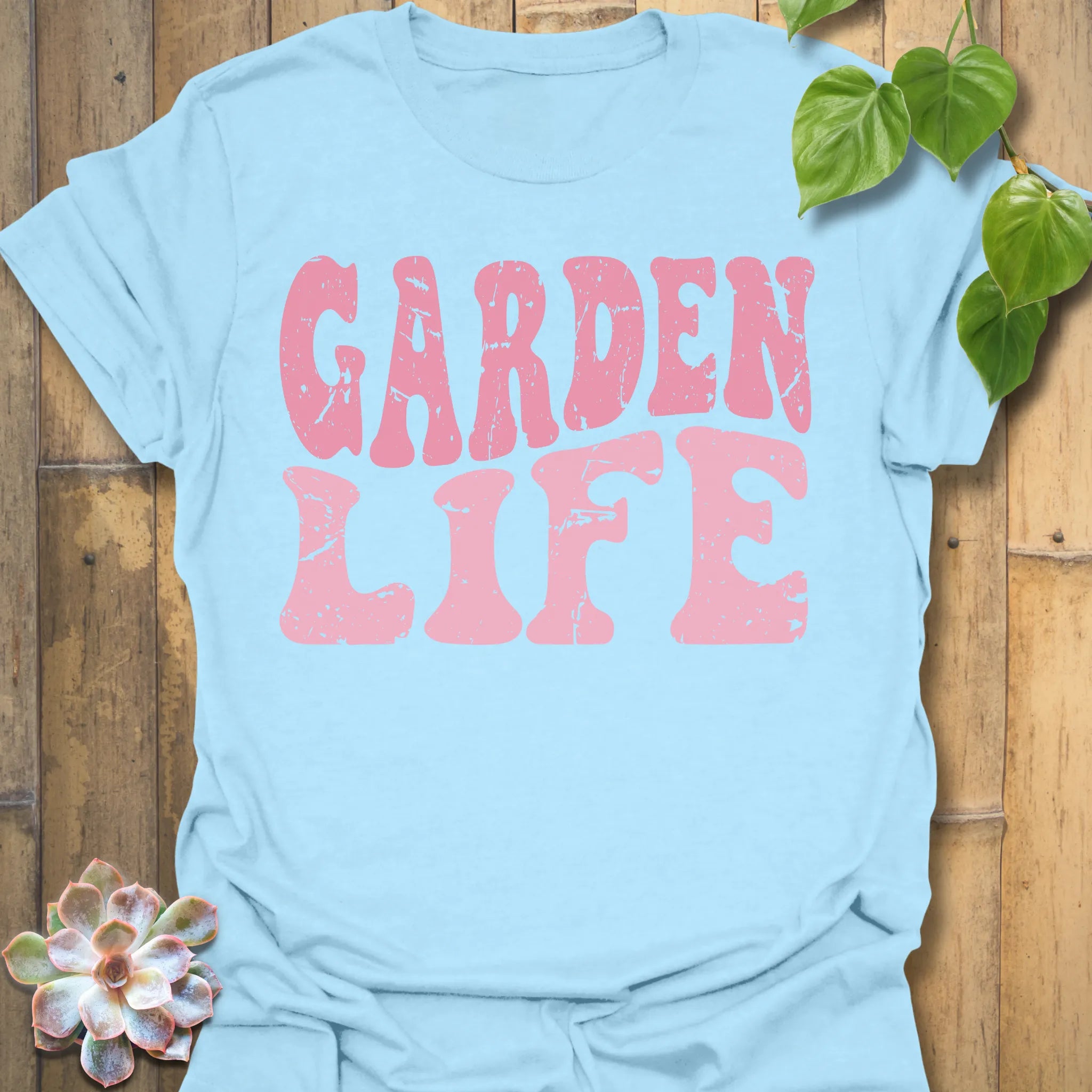 Light Blue t-shirt featuring the design Garden Life printed in bold letters, garden lover shirt.