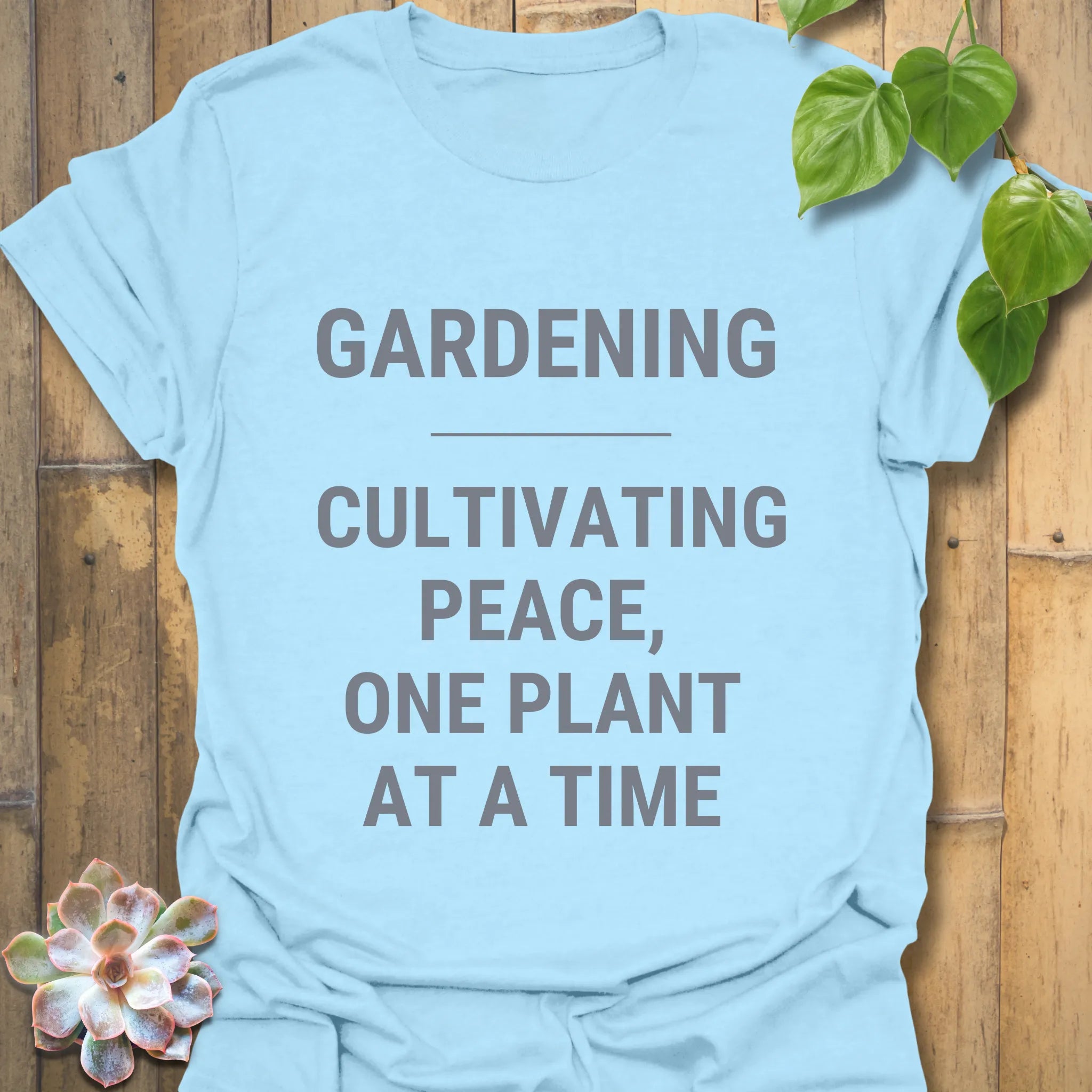 Light Blue t-shirt featuring the design Gardening Cultivating Peace One Plant at a Time, gardening gift tee.