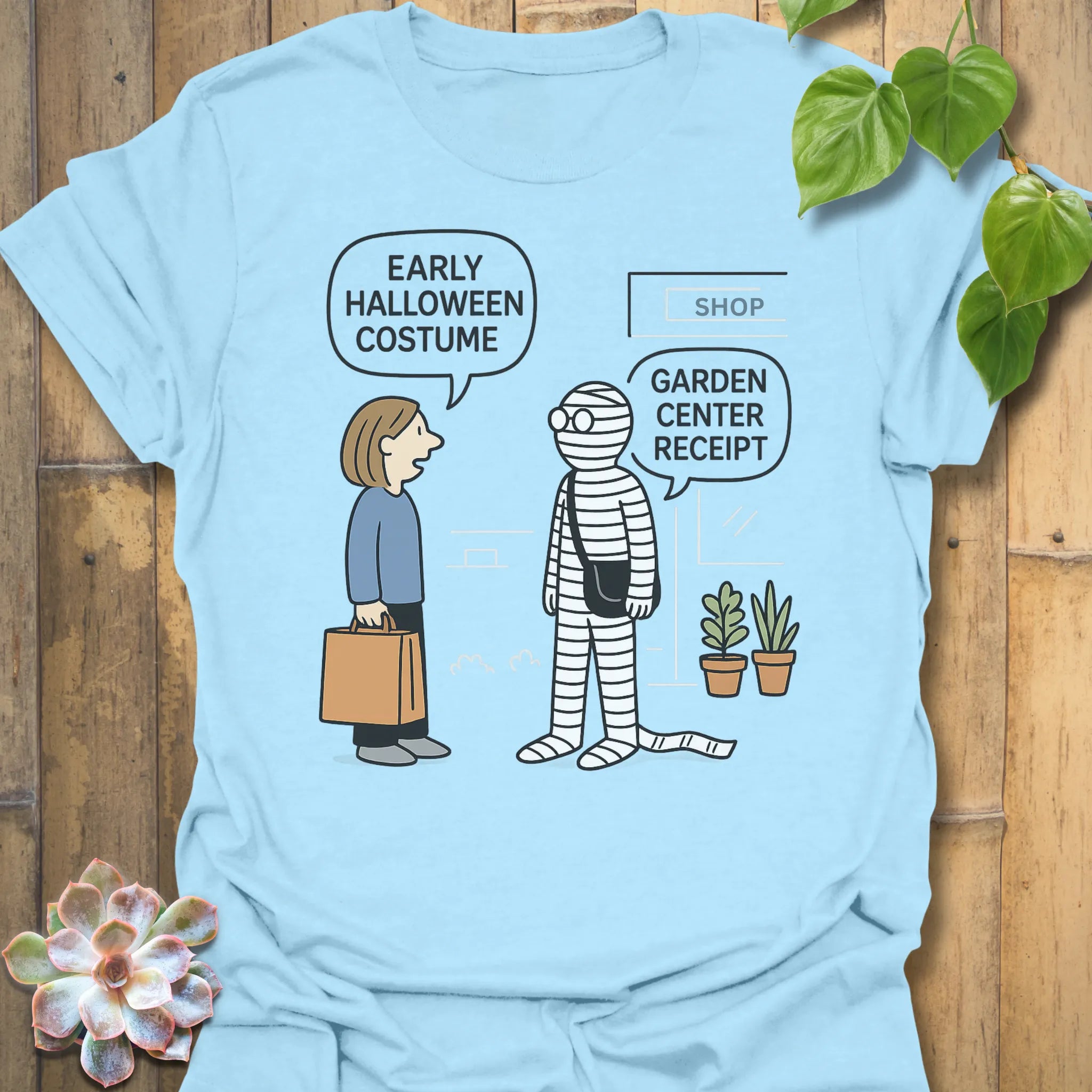 Light Blue t-shirt featuring the design Halloween Costume printed in bold letters, stylish Halloween top.