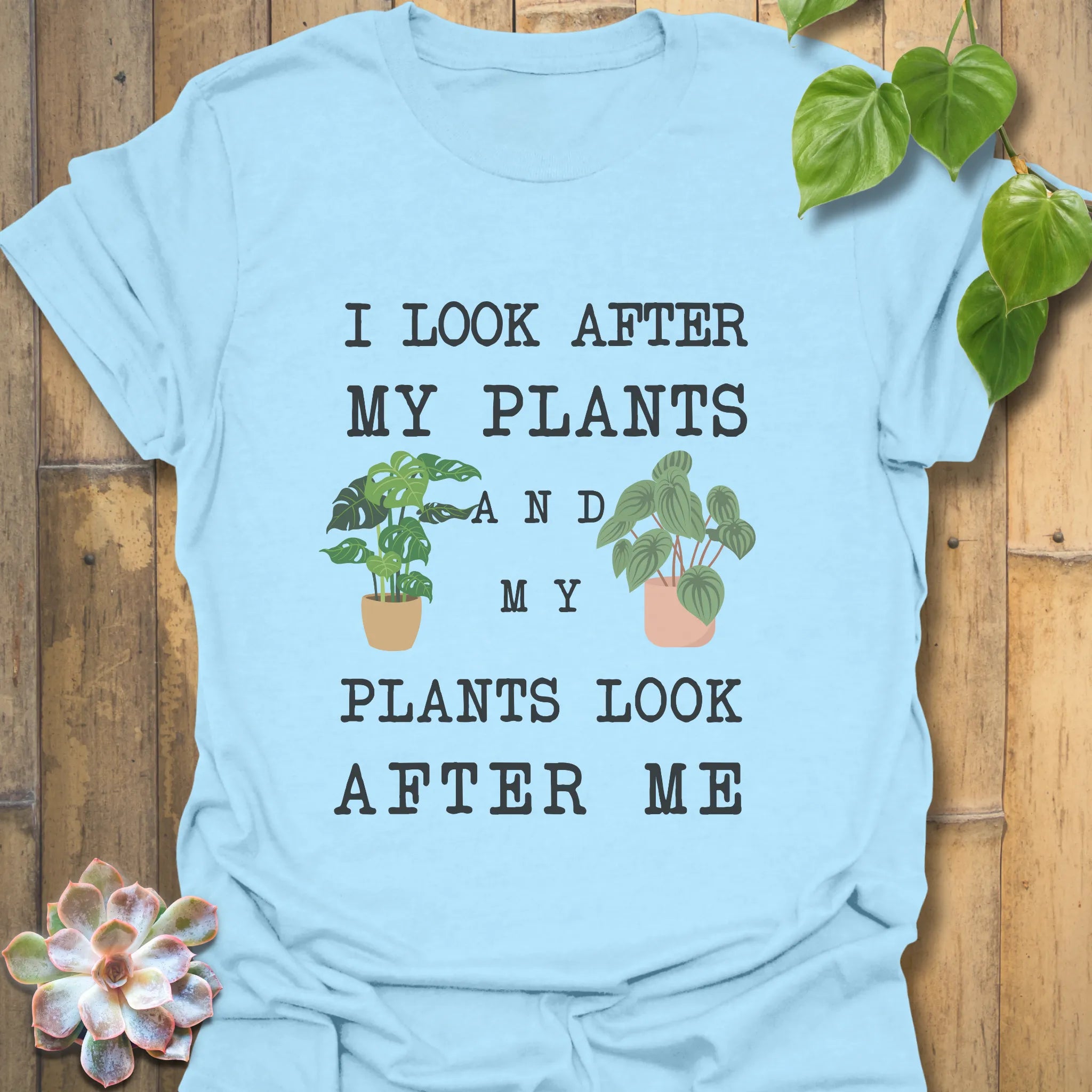 Light Blue t-shirt featuring the design “I look after My Plants and my plants look after me” nature lover shirt.