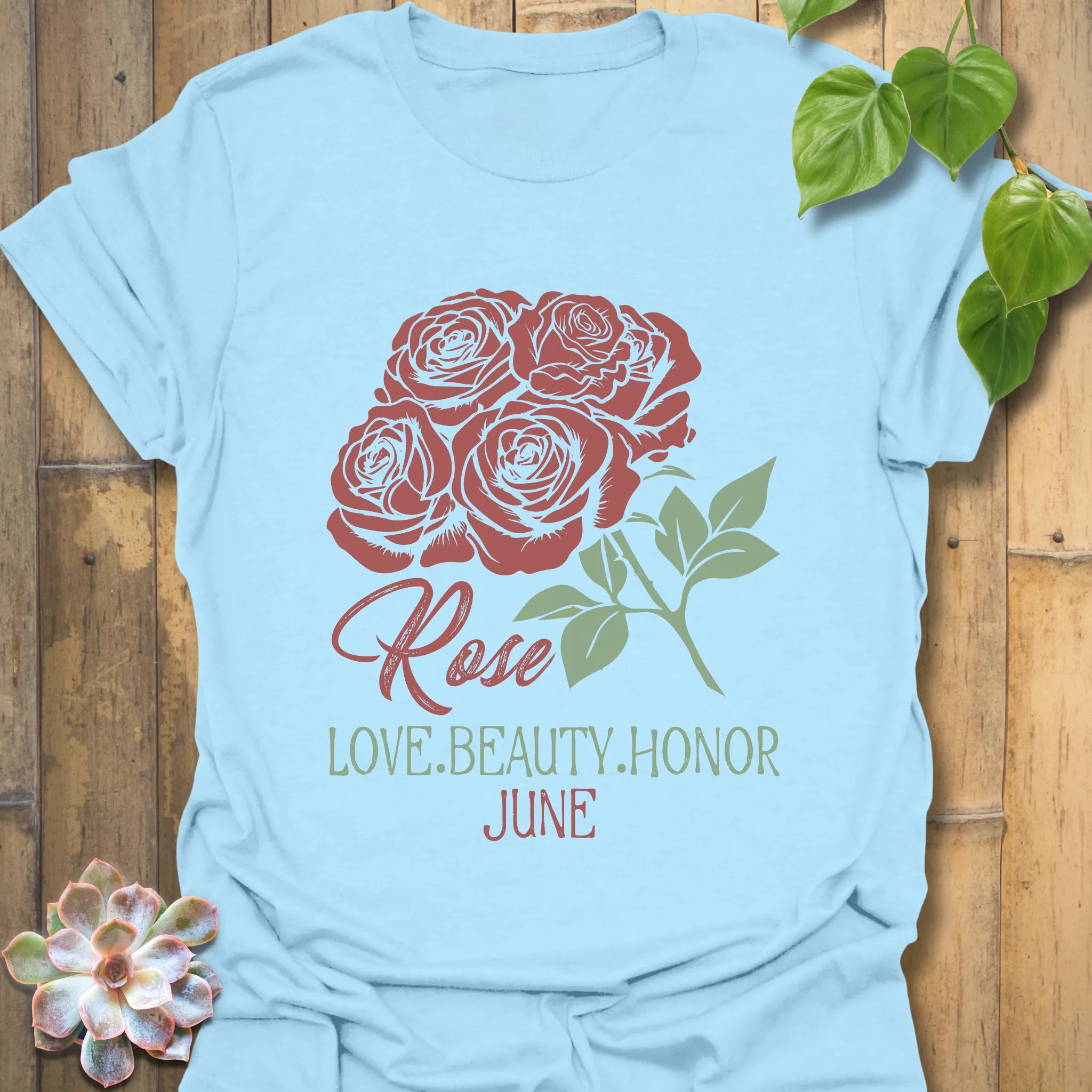 Light Blue t-shirt featuring the design June Rose with a soft rose flower print, a floral graphic tee ideal for summer outfits.