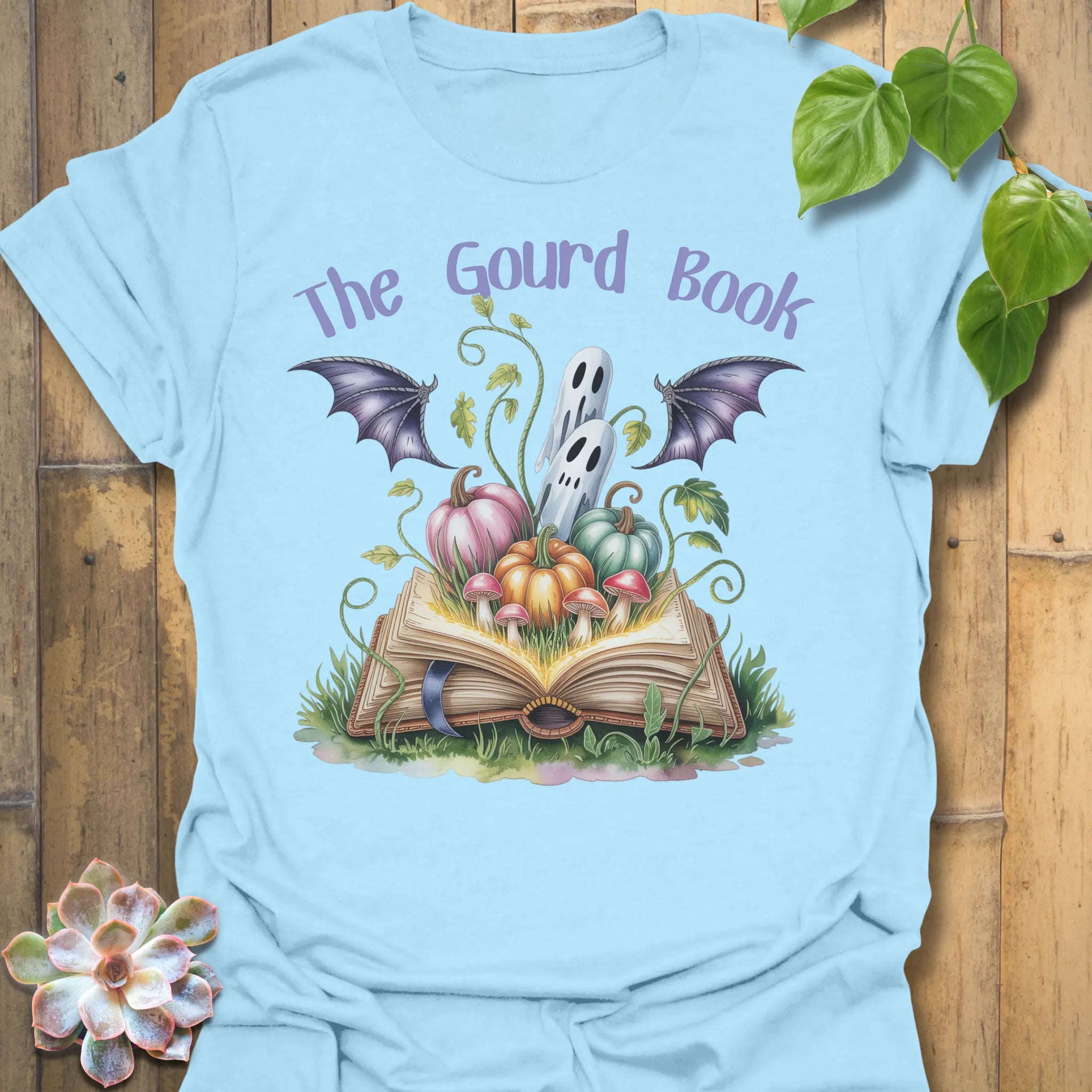 Light Blue t-shirt featuring the design The Gourd Book printed in halloween pumpkin shirt.