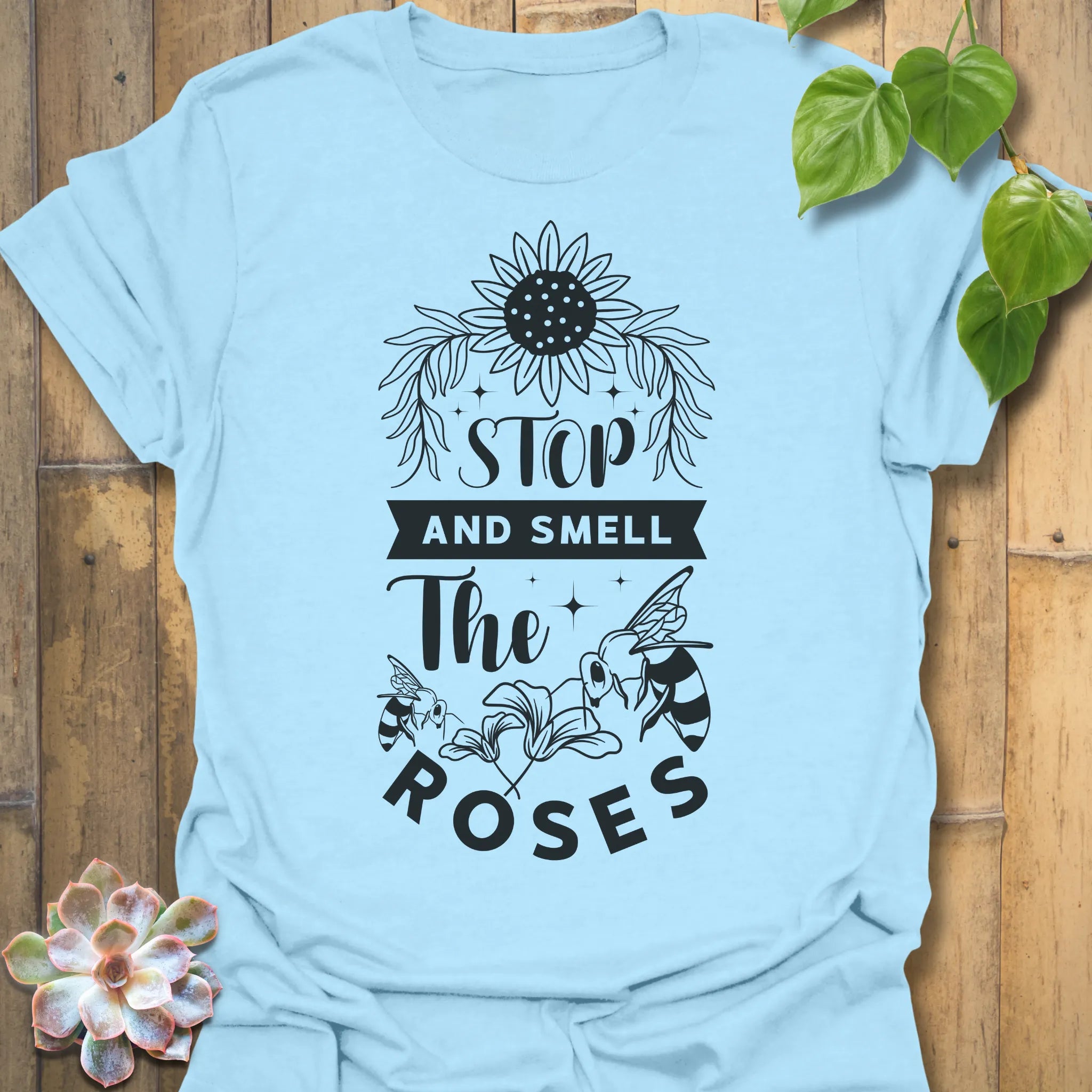 Light Blue t-shirt featuring the design The Roses printed in artistic flower, floral graphic tee.