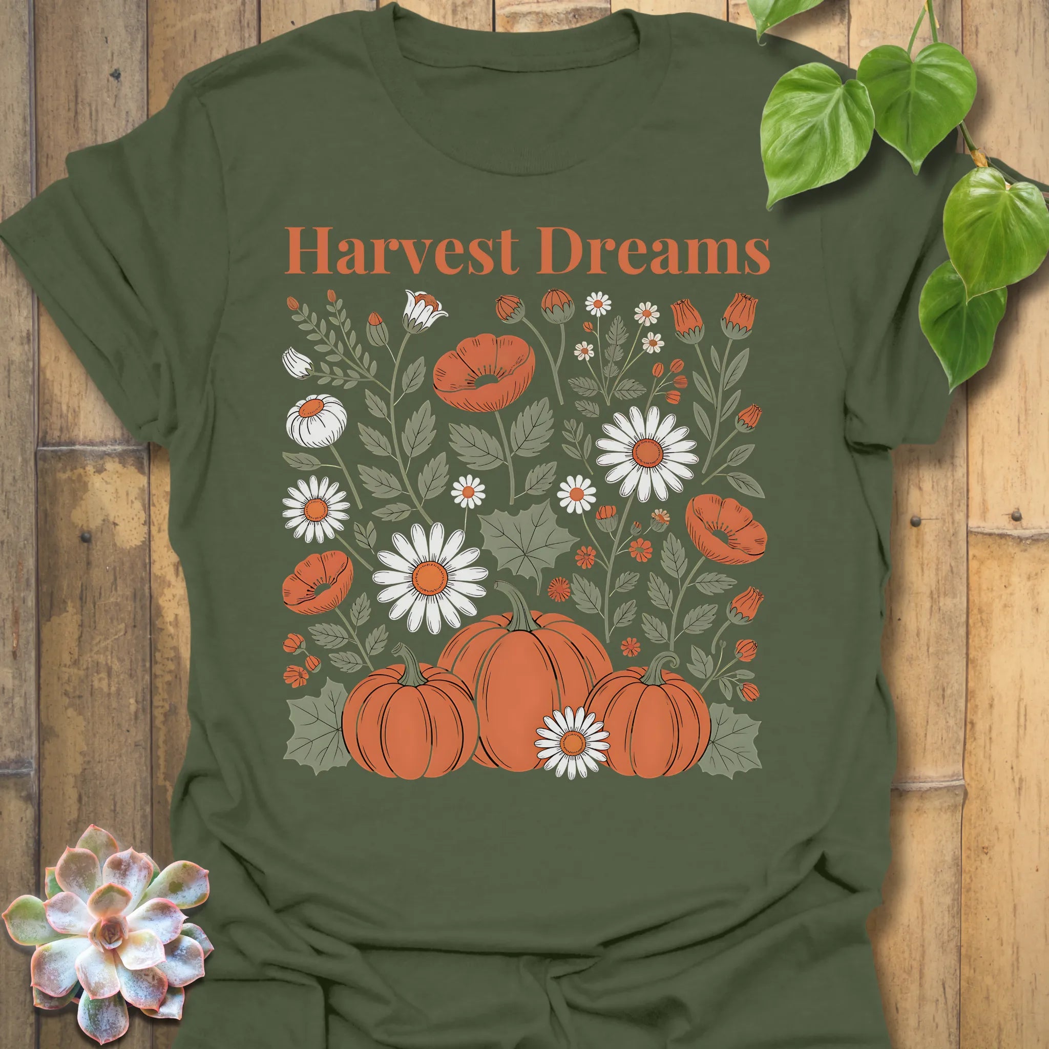 Military Green t-shirt featuring the design Harvest Dreams printed in bold orange letters, cosy harvest tee.