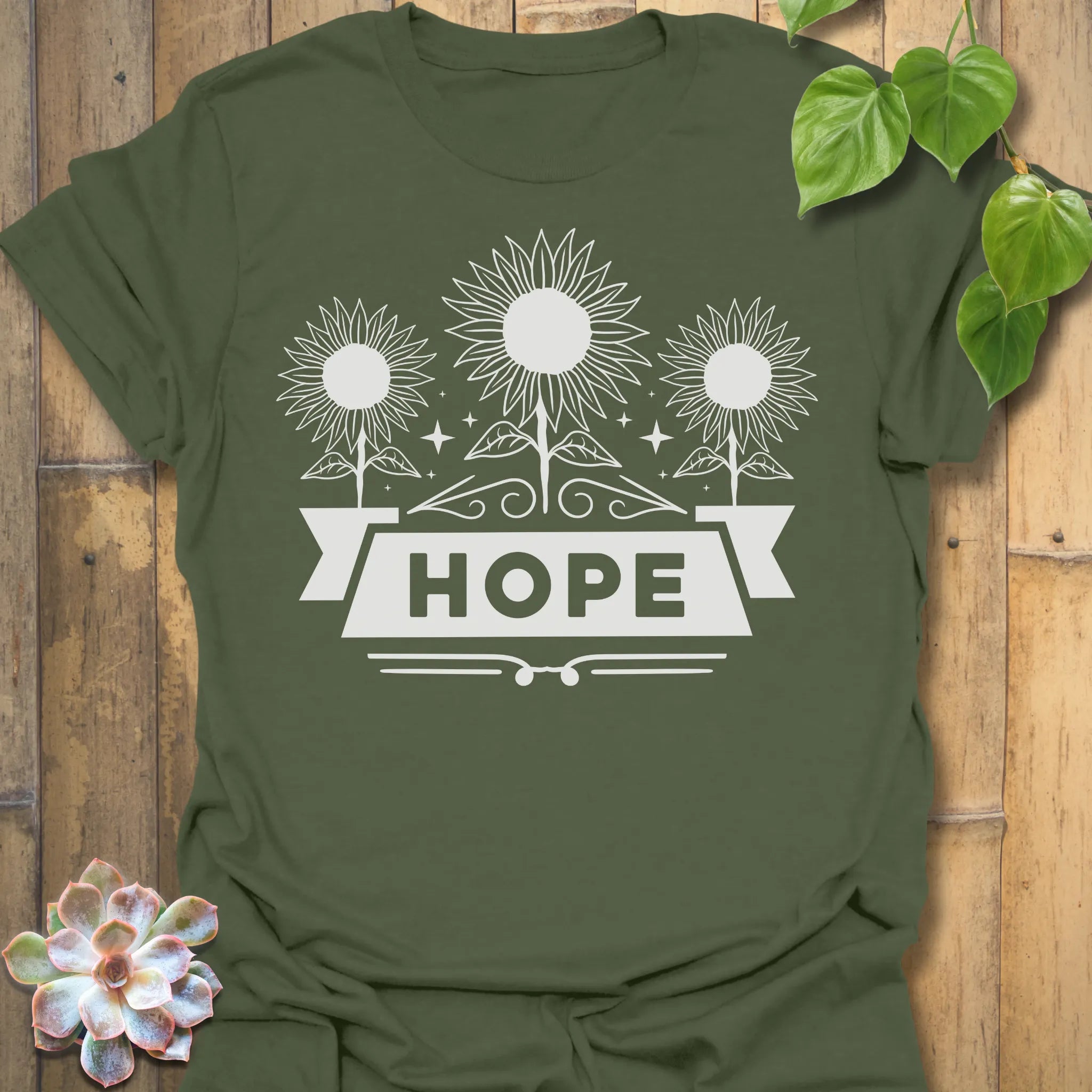 Military Green t-shirt featuring the design Hope printed in sunflower and bold letters, positive vibe t-shirt.