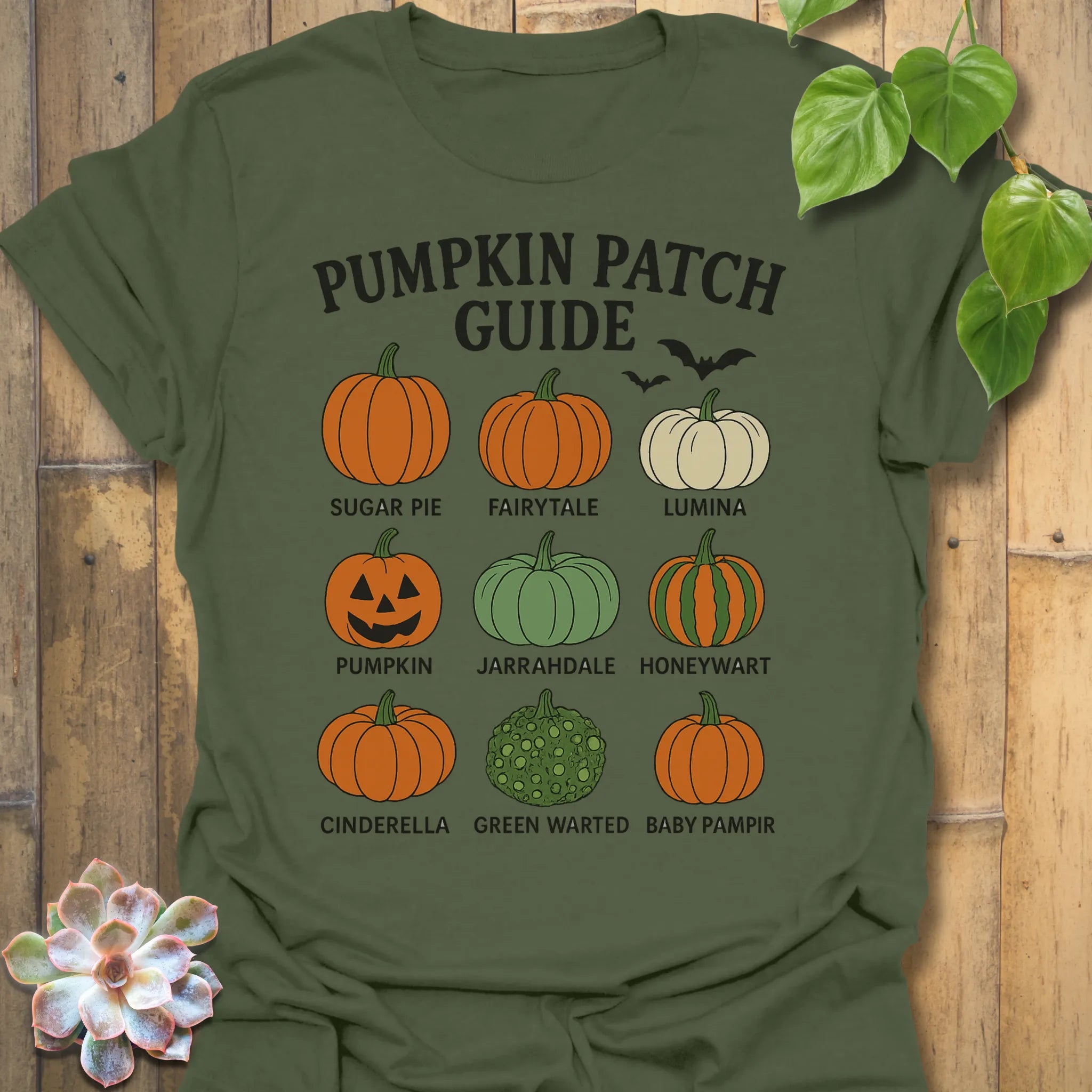 Military Green t-shirt featuring the design Pumpkin Patch Guide printed in black letters, Halloween pumpkin tee.