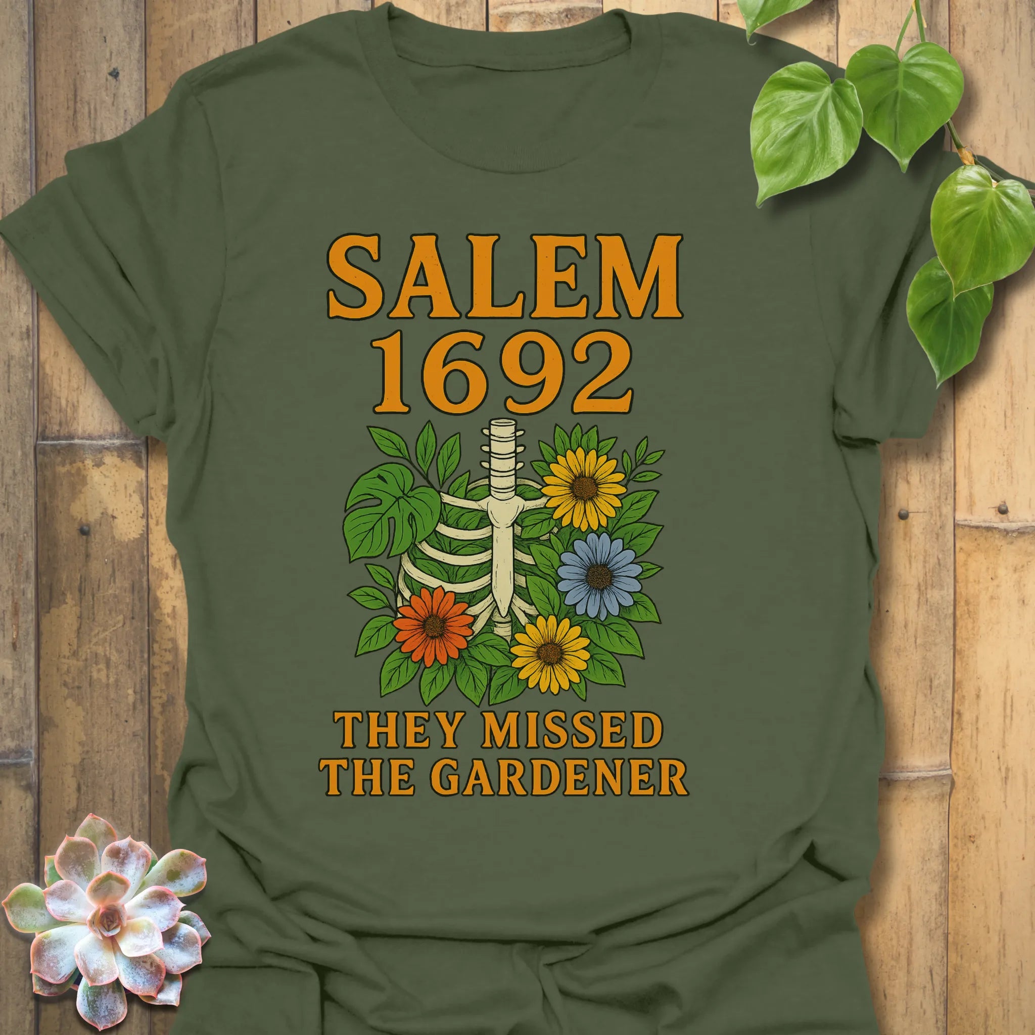 Military Green t-shirt featuring the design Salem 1692 printed in bold letters, vintage halloween graphic tee.