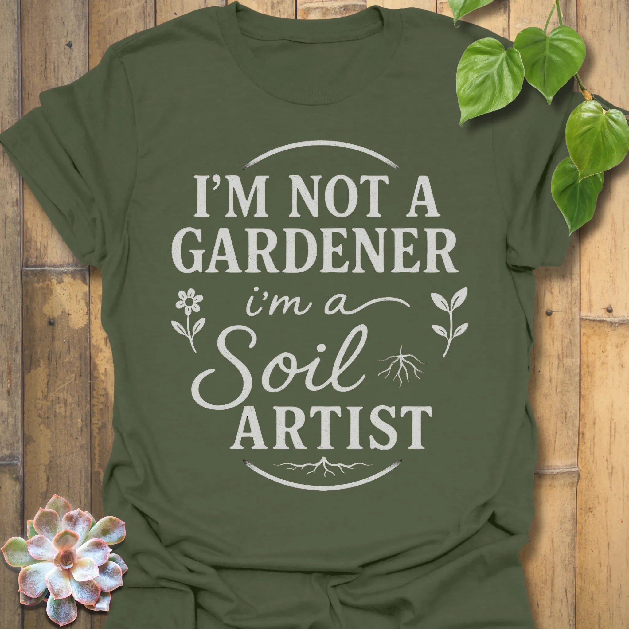 Military Green t-shirt featuring the design Soil Artist printed in bold letters, funny garden shirt.