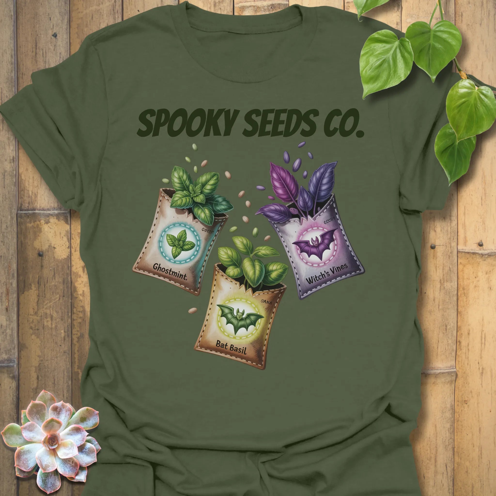 Military Green t-shirt featuring the design Spooky Seeds Co. printed in bold letters, spooky plant lover shirt.