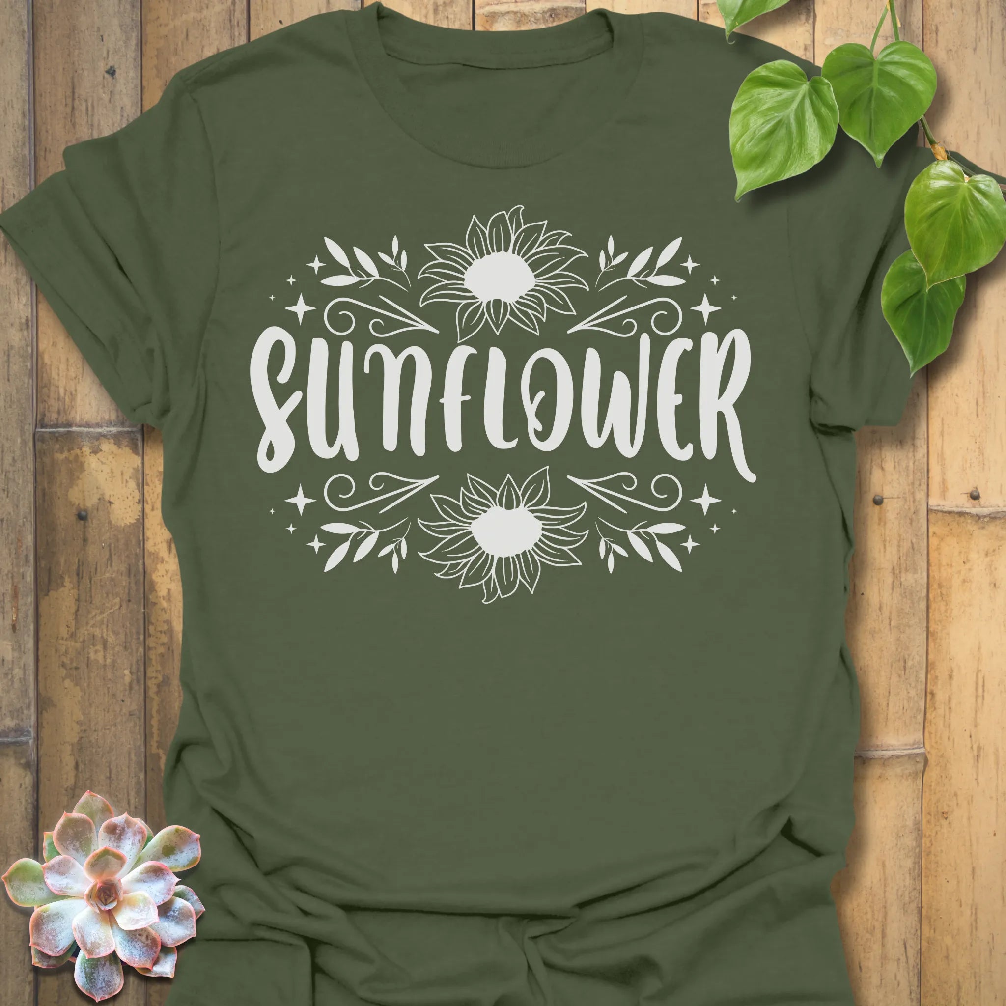 Military Green t-shirt featuring the design Sunflower printed inbold white, sunflower floral graphic tee.