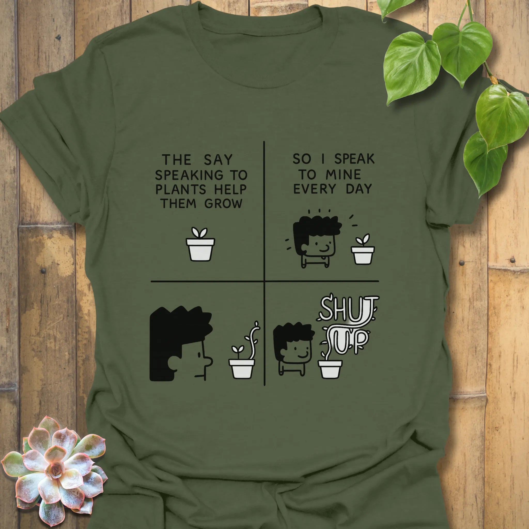 Military Green t-shirt featuring the design “The say speaking to plants help them grow so I speak to mine everyday” with a funny character of a man and plants printed in bold colours