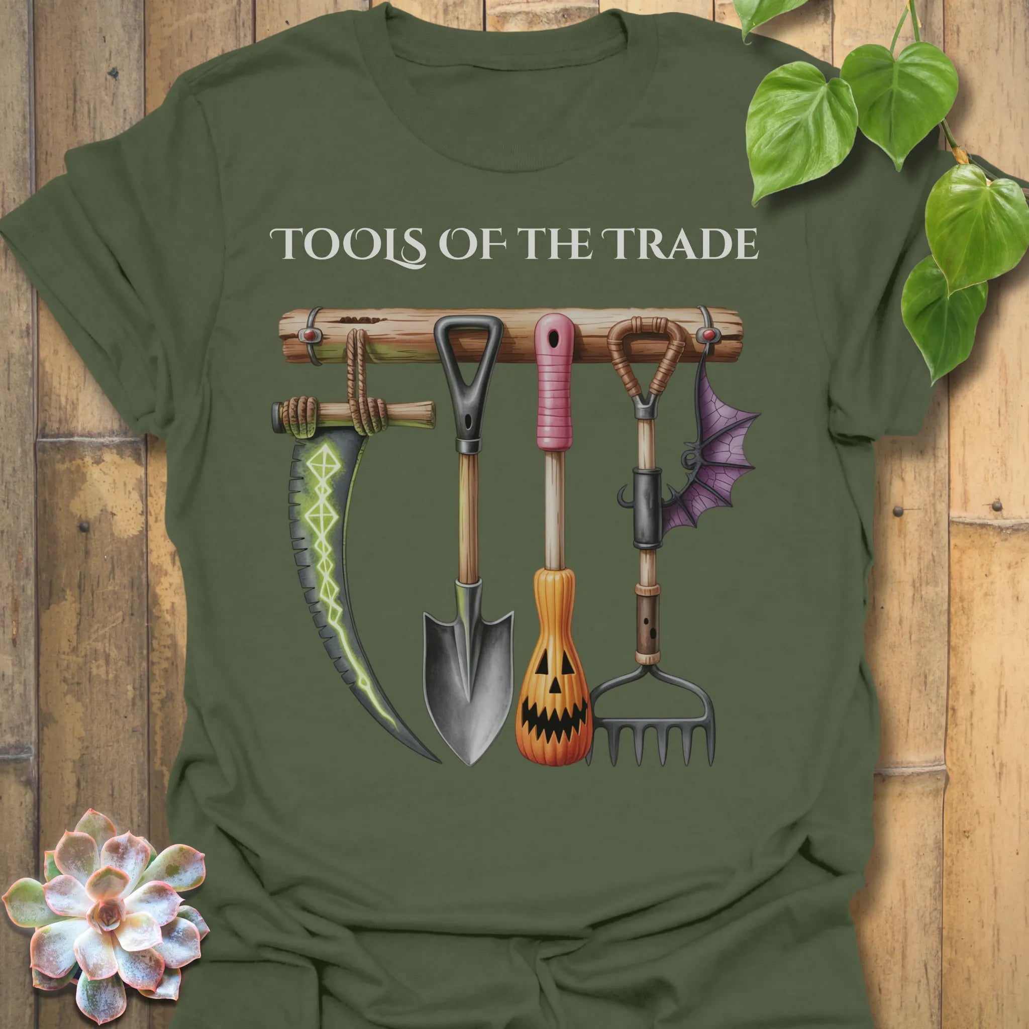 Military Green t-shirt featuring the design Tools Of The Trade printed in bold letters, garden tools shirt.