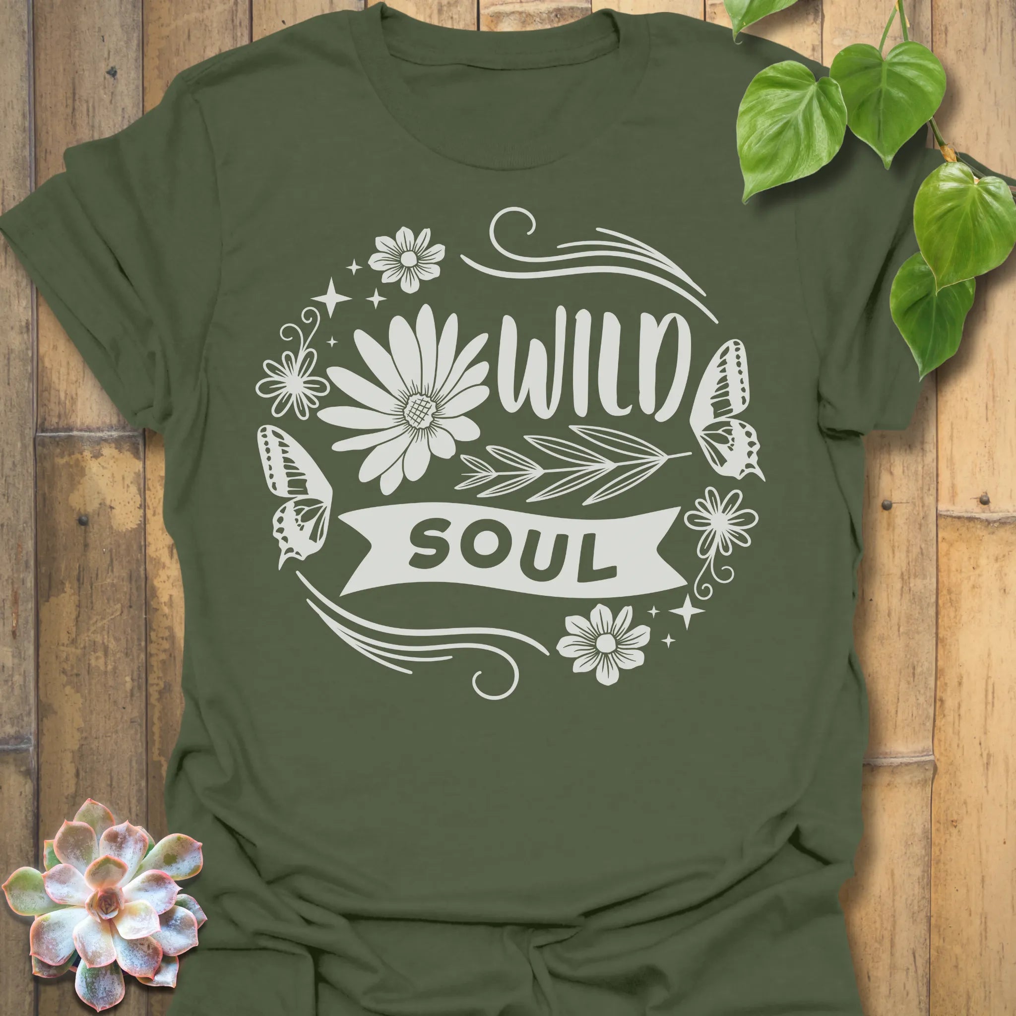 Military Green t-shirt featuring the design Wild Soul printed in bold black letters, floral graphic tee.