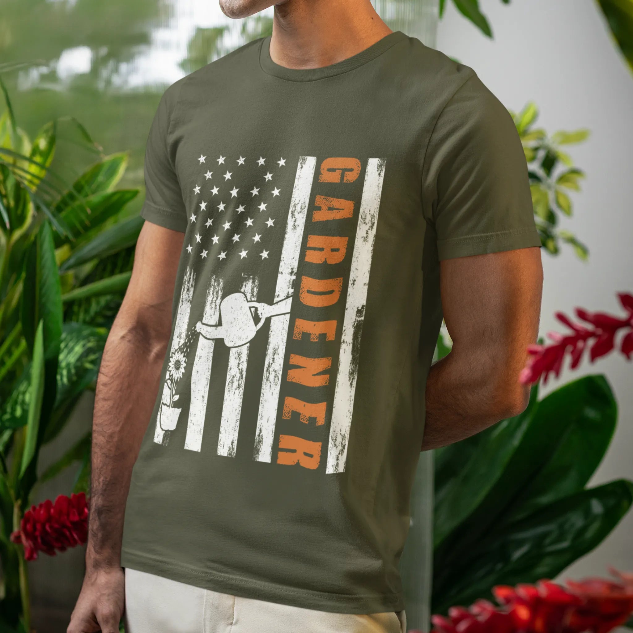 Military green American flag garden t-shirt featuring the design Gardener with a vertical word, plant, and watering sprinkler print, ideal for proud gardeners