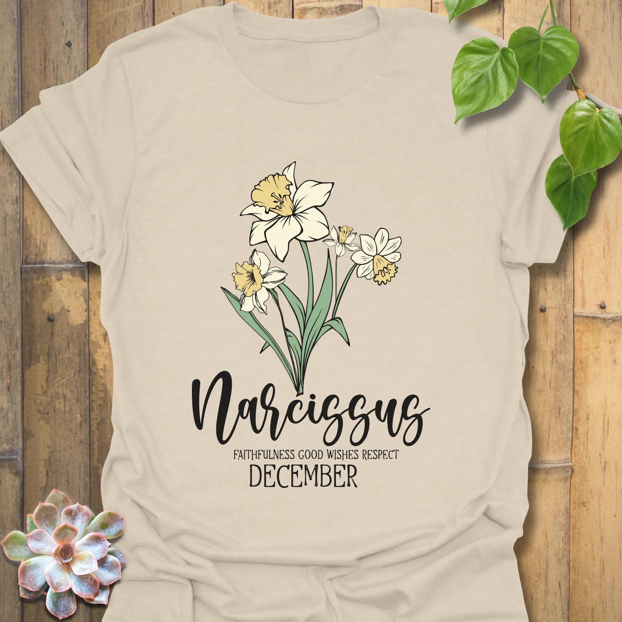 Natural t-shirt featuring the design December Narcissus showcasing a narcissus flower print, an elegant floral graphic t-shirt for everyday wear