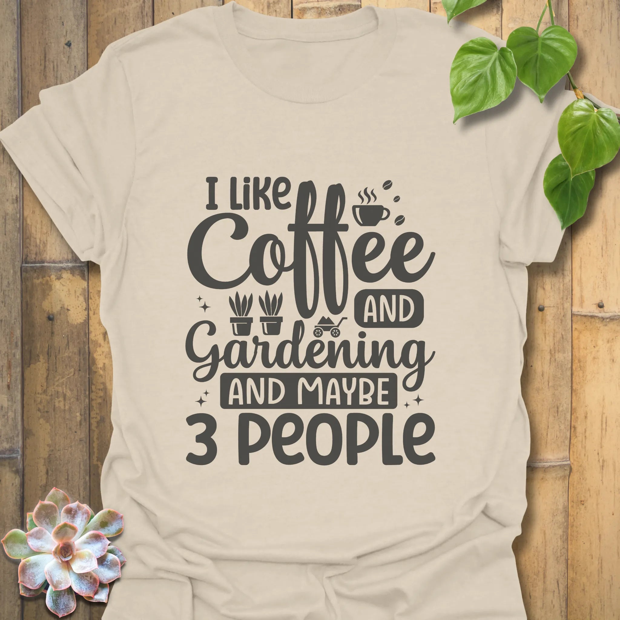 Natural t-shirt featuring the design "I like coffee and gardening and maybe 3 people" eco-style gardening shirt.