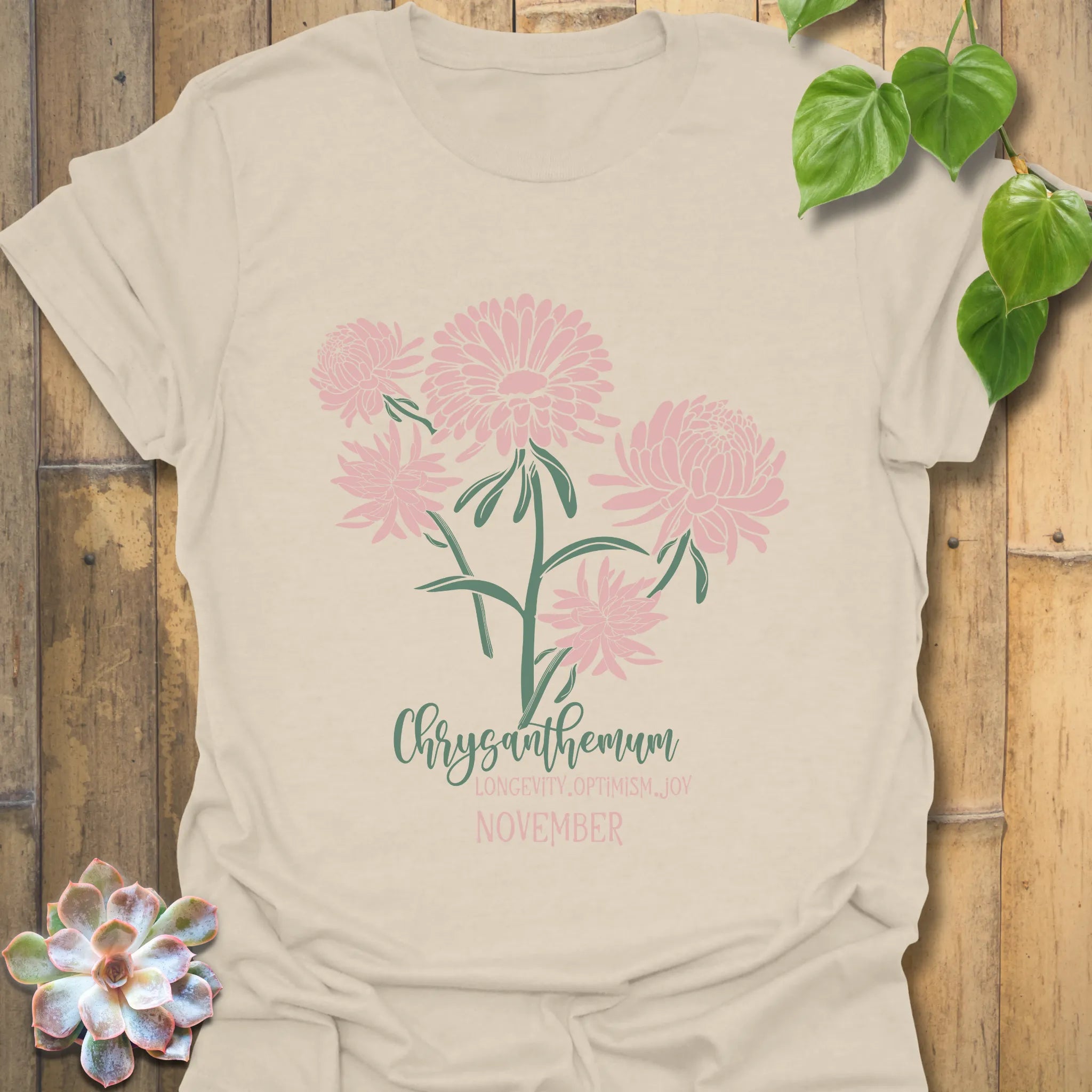 Natural t-shirt featuring the design November Chrysanthemum with a chrysanthemum flower illustration, stylish botanical graphic tee for women and men.