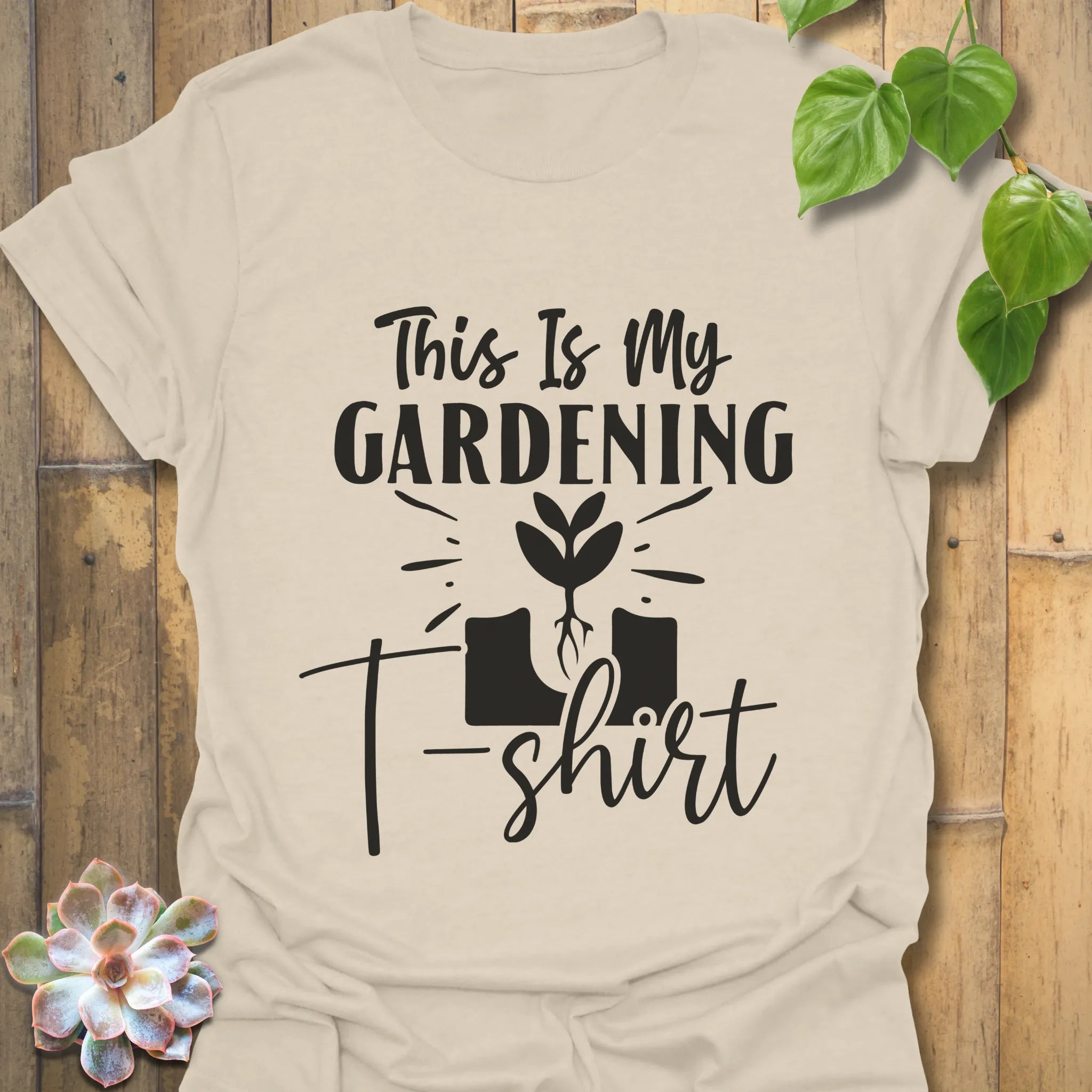 Natural t-shirt featuring the design This Is My Gardening T-shirt printed in bold lettering, a funny gardening shirt for plant lovers.
