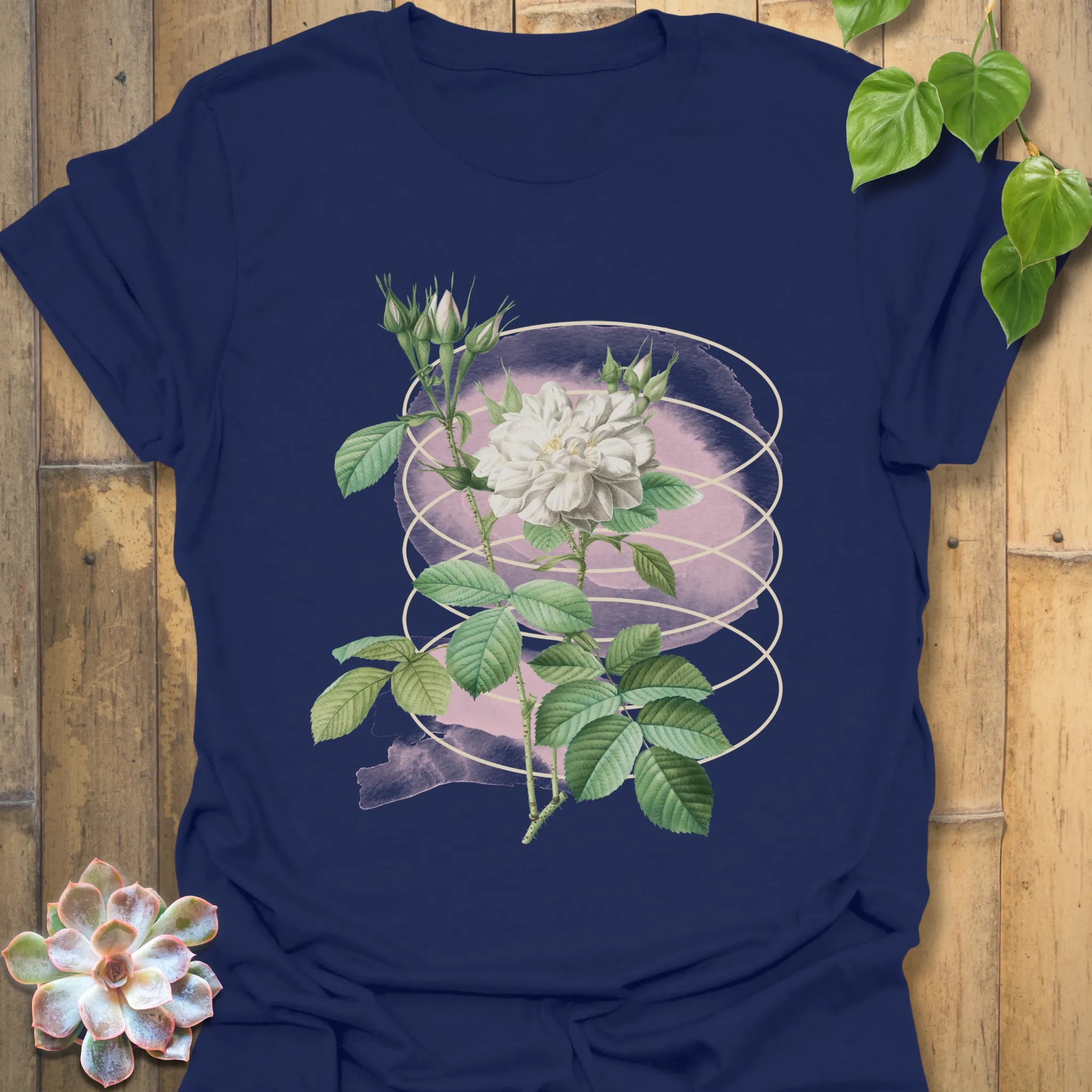 Navy t-shirt featuring the Blossom Whisper design of a blooming flower artwork