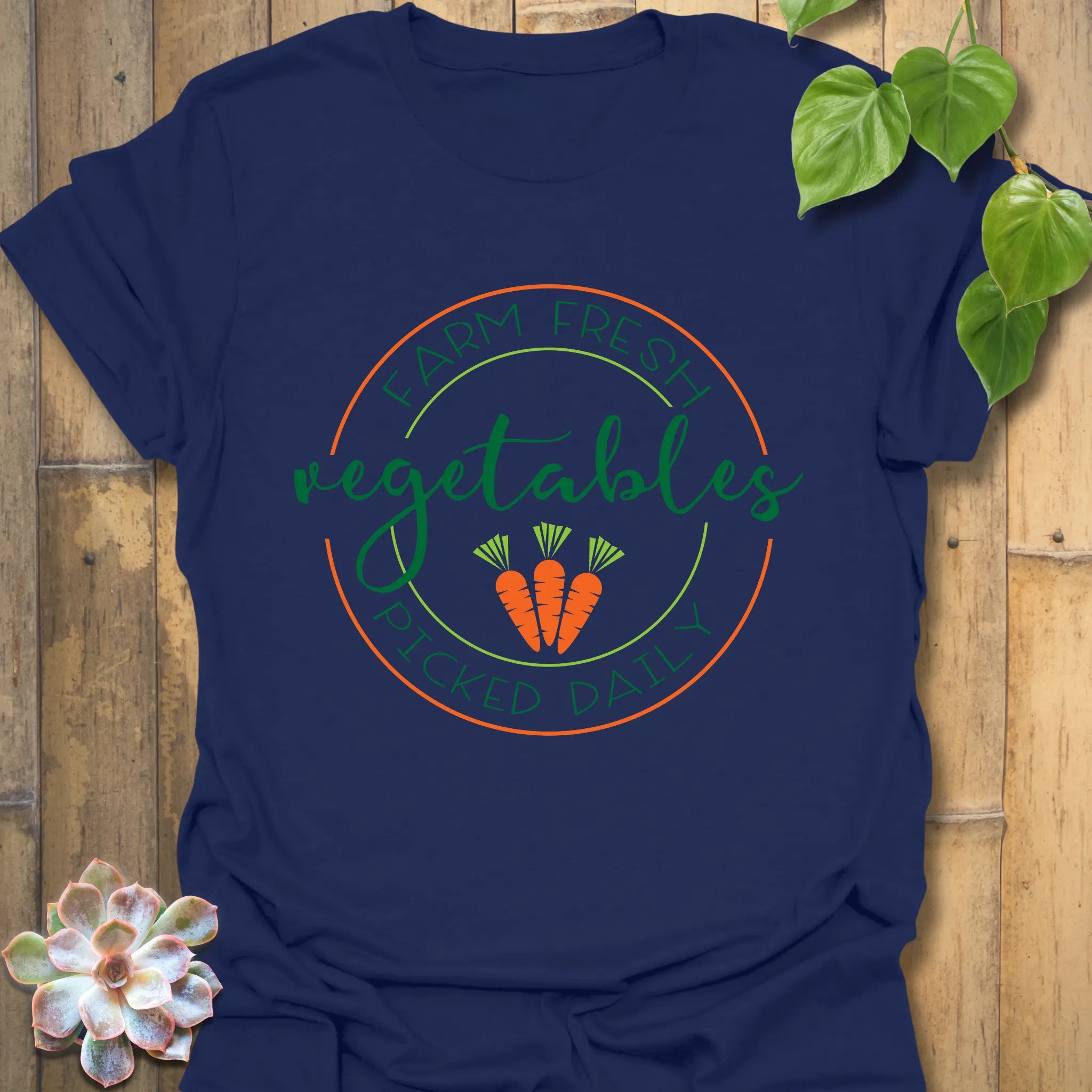 Navy t-shirt featuring the design Farm Fresh Vegetables Picked Daily with colourful veggie illustration, farm-to-table graphic tee.